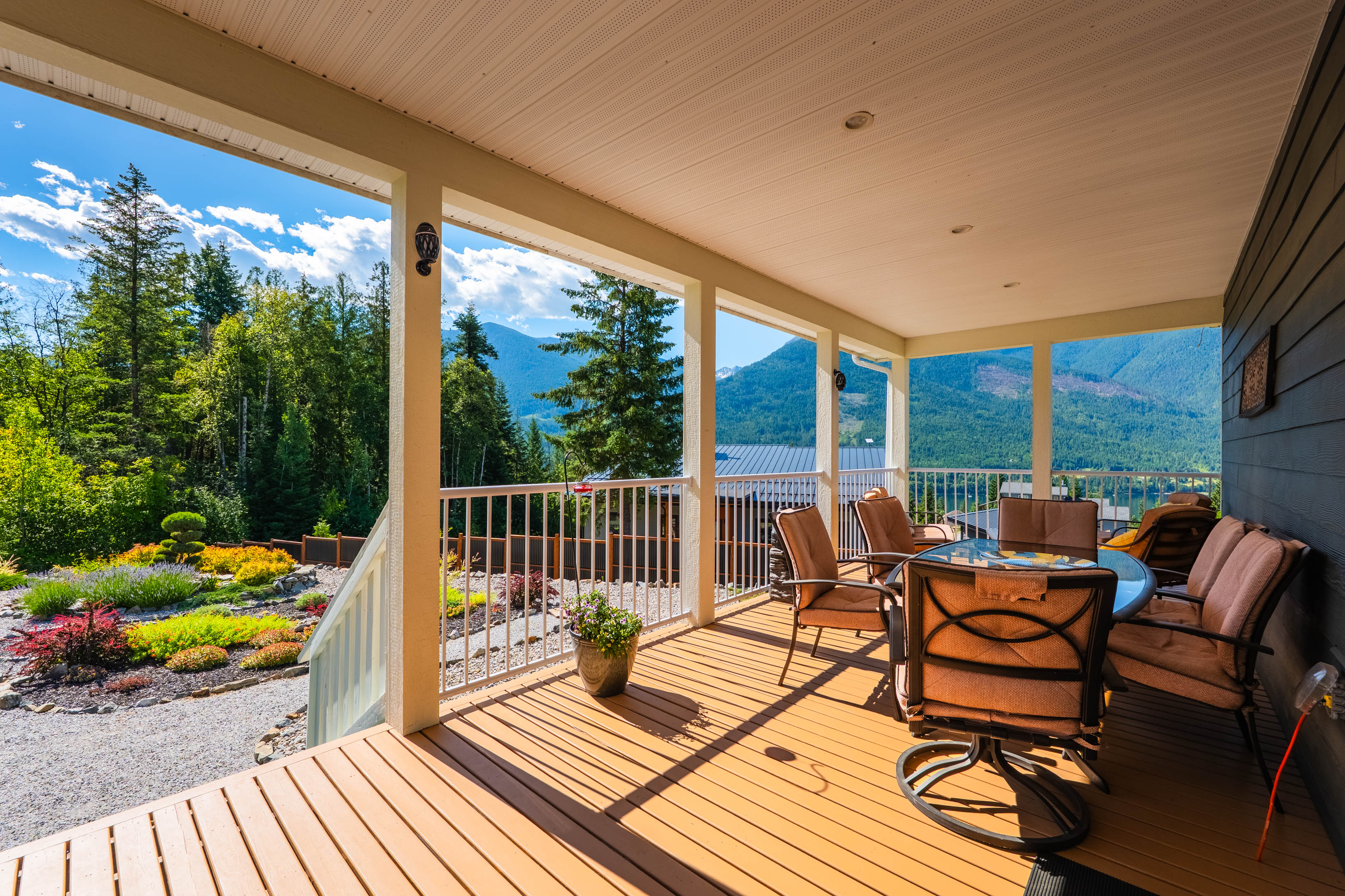 Covered deck at 430 Buriview Drive with seating and mountain views