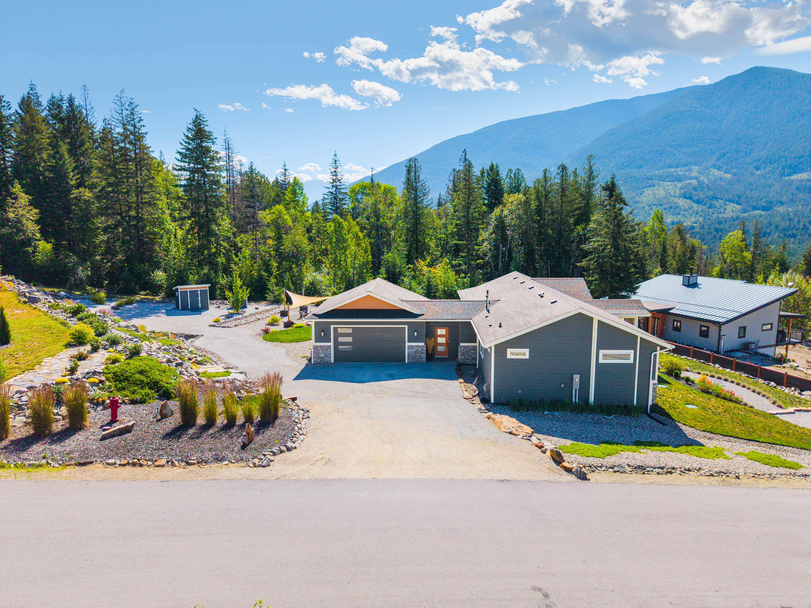 Aerial arrival view of 430 Buriview Drive showing the attached over-height double garage and driveway