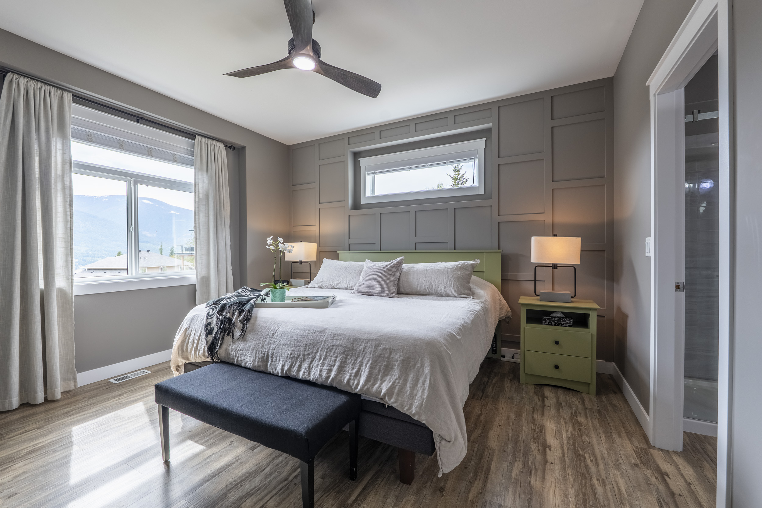 Primary bedroom at 430 Buriview Drive with mountain views and ensuite access