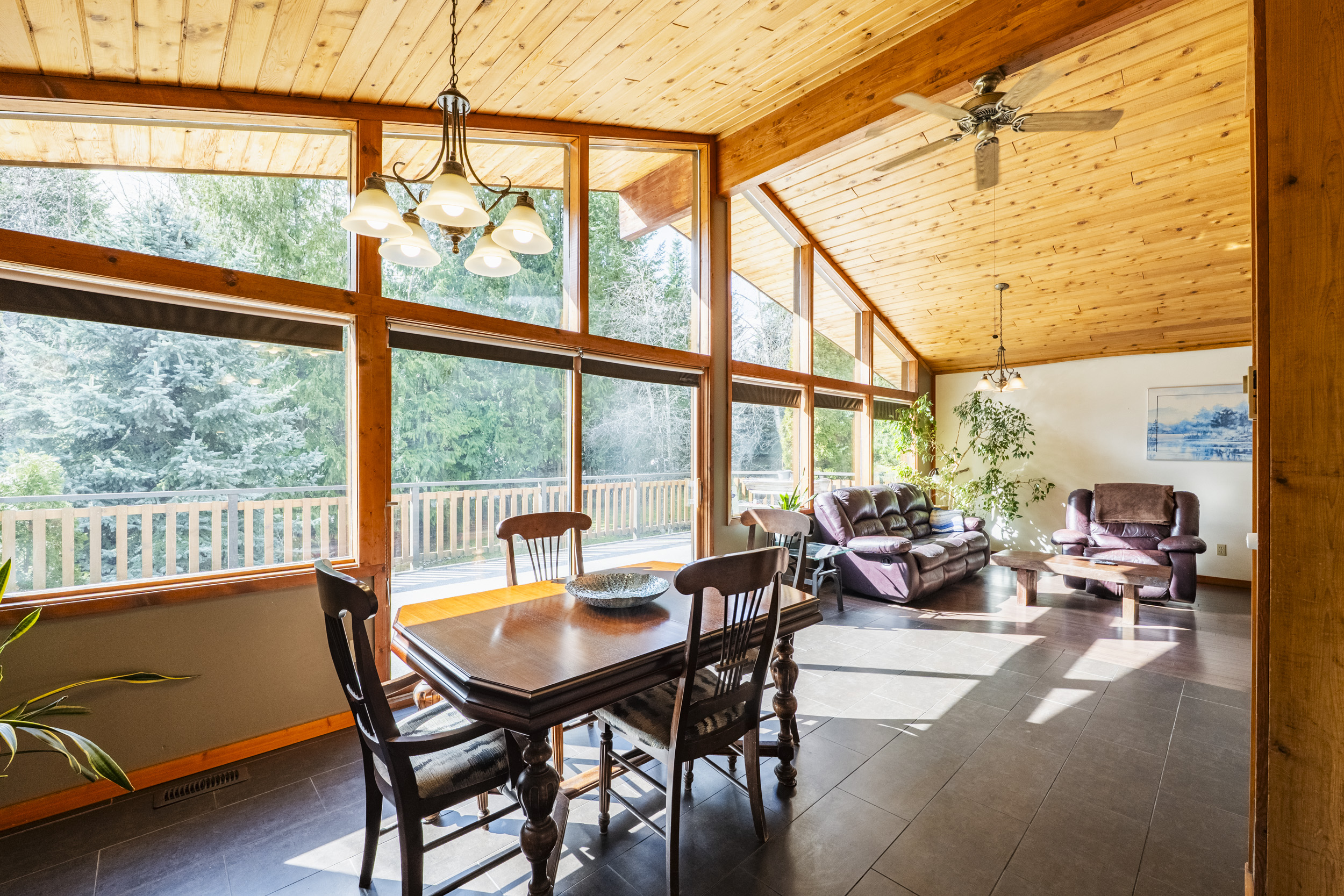 Open dining and living area connecting to the deck at 7077 Beggs Road