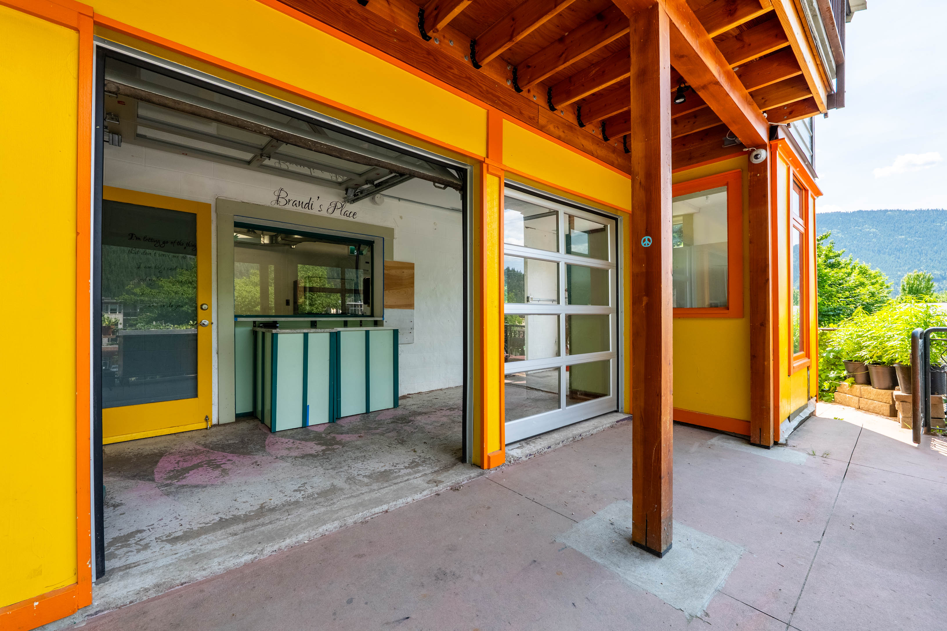 Lower-level covered storefront and commercial entrance at 512 Hendryx Street
