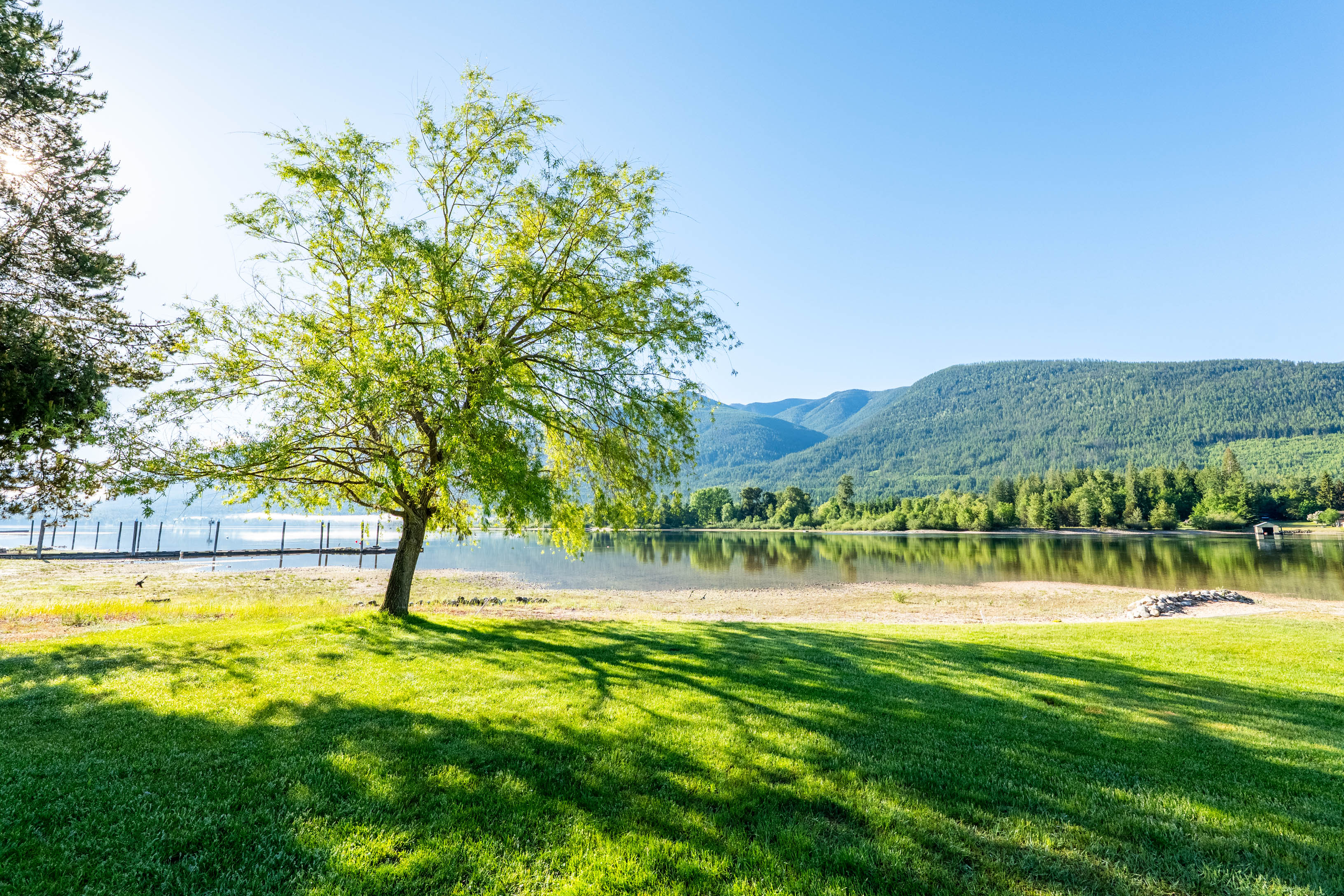 Peaceful Balfour-area waterfront lawn beside Kootenay Lake