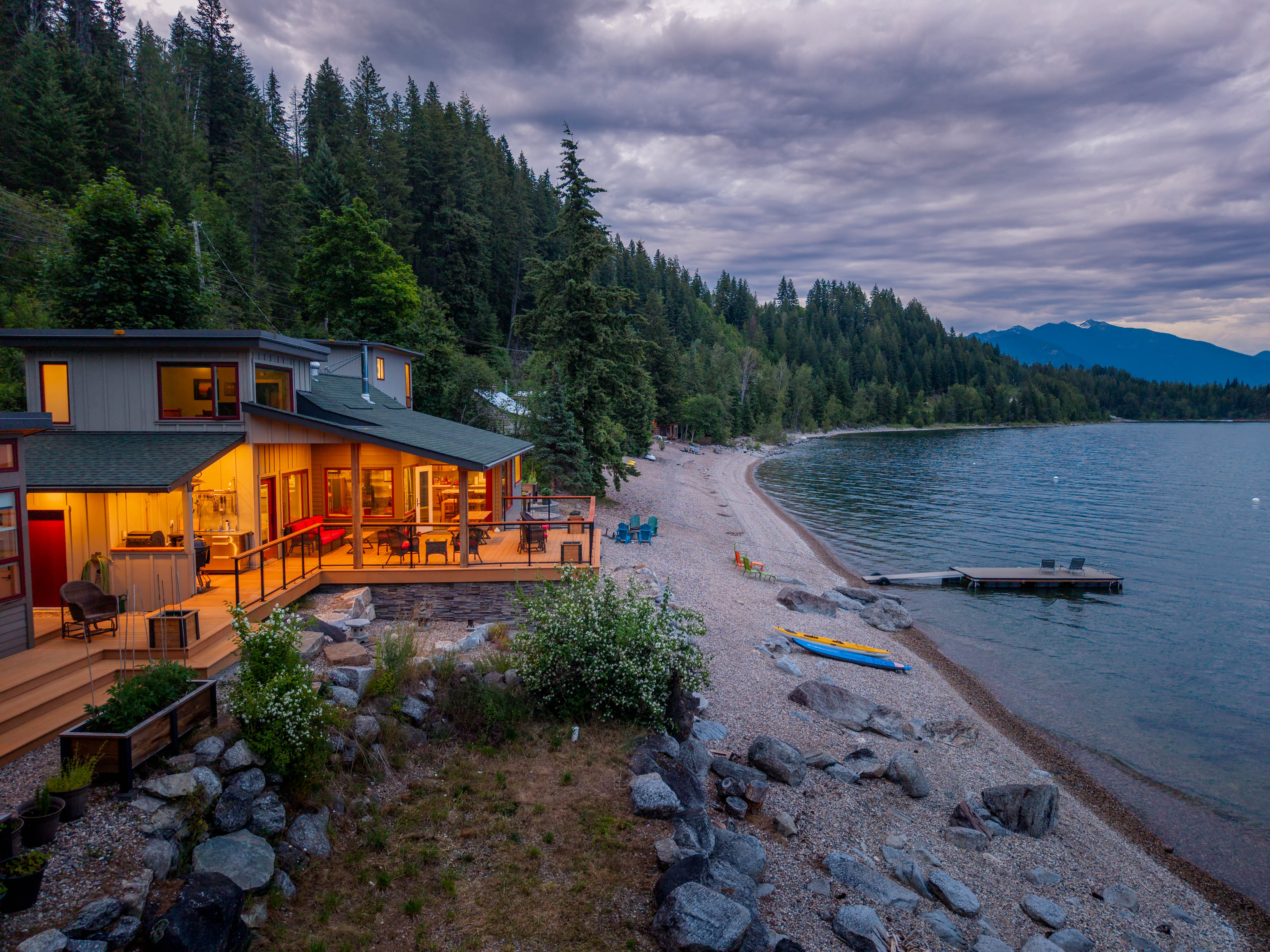 1726 Highway 31 illuminated beside Kootenay Lake