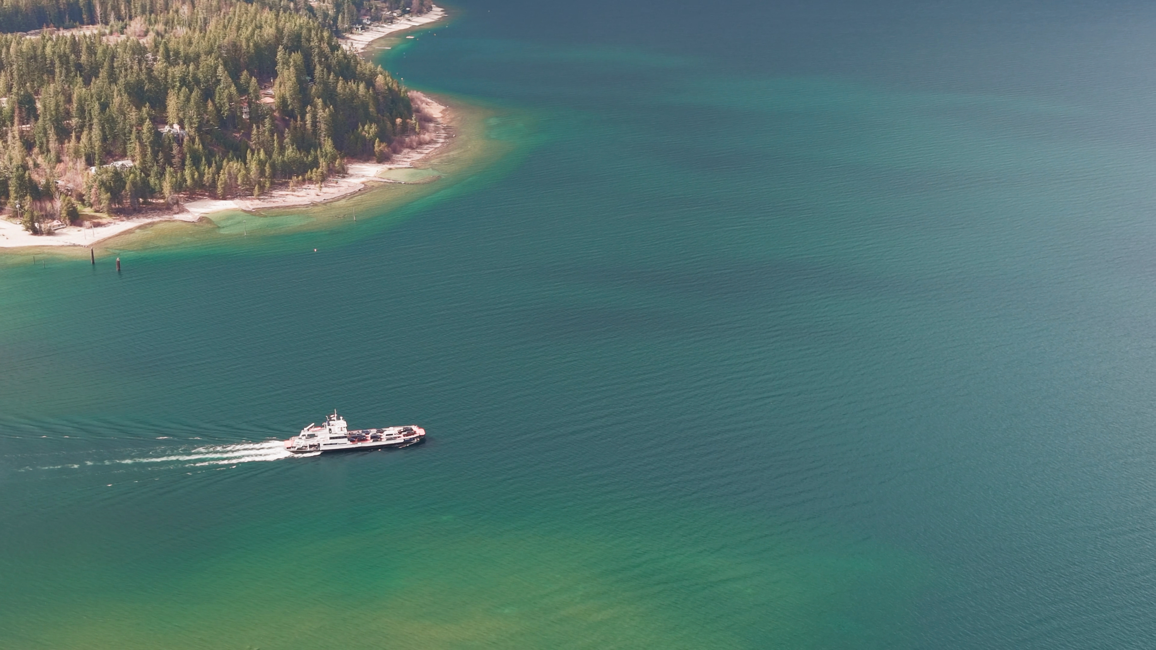 Kootenay Lake Ferry underway beneath mountain scenery