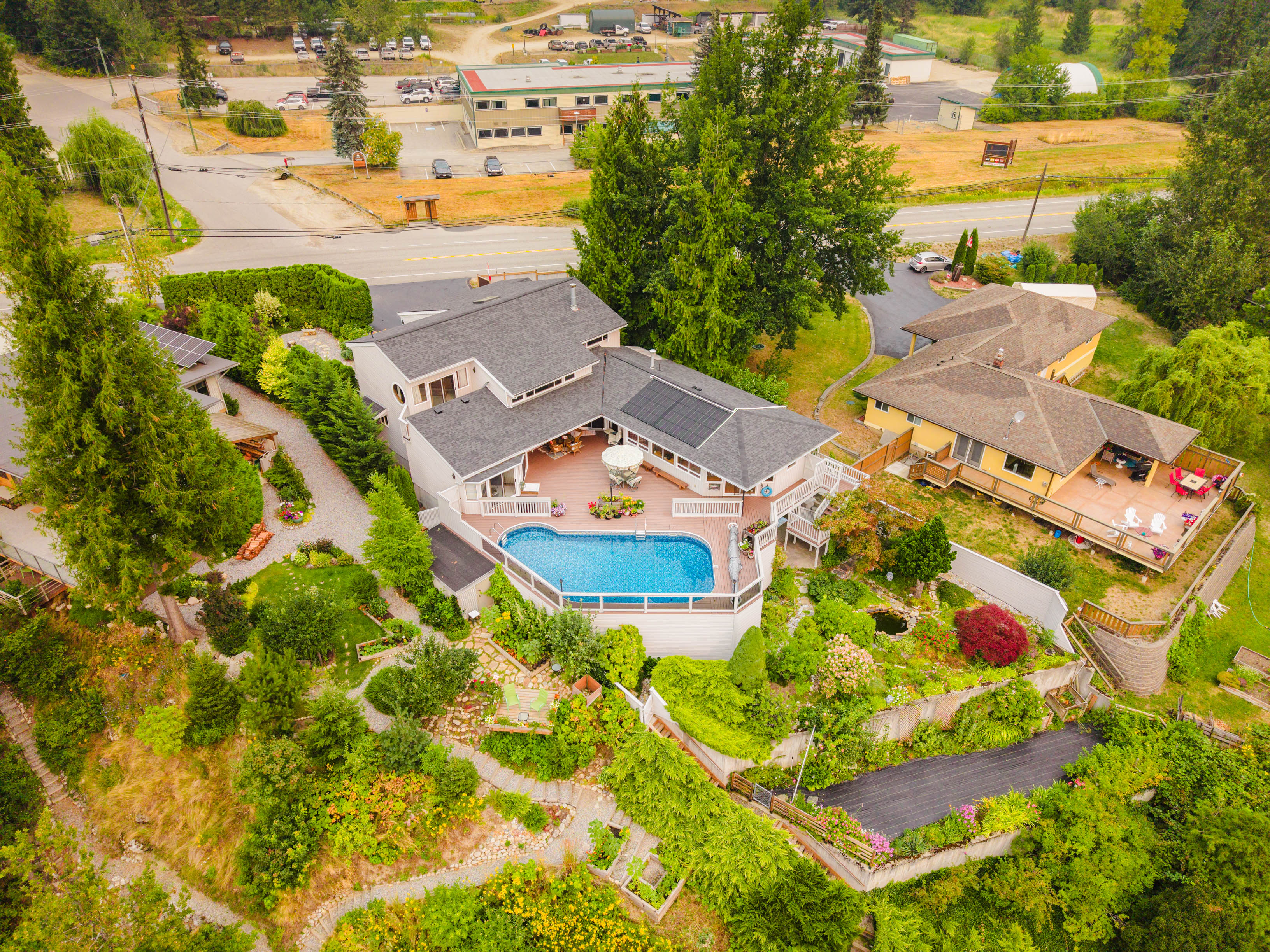 Waterfront home, pool and landscaped grounds at 1896 Highway 3A