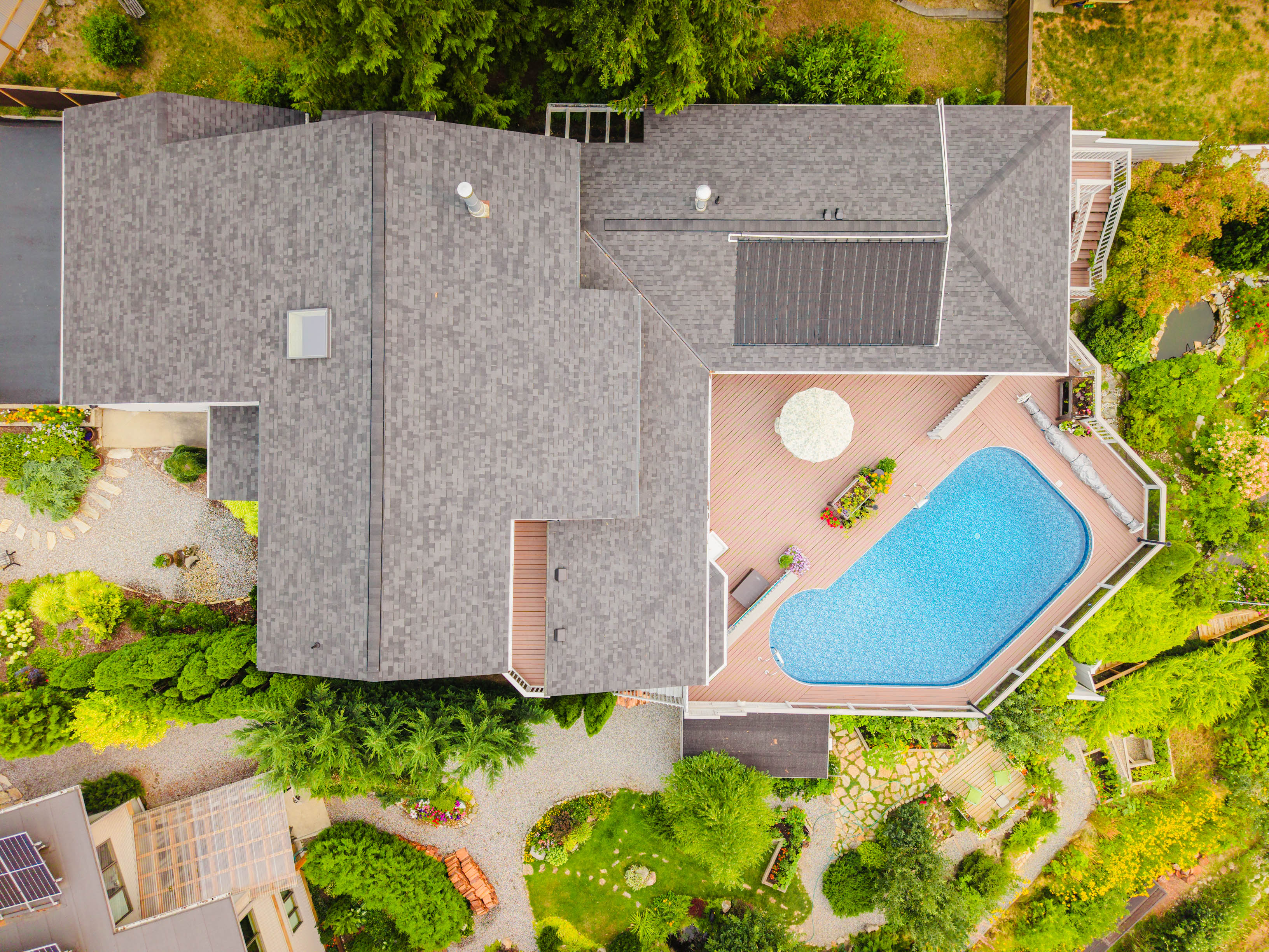 Pool, gardens and Kootenay Lake view