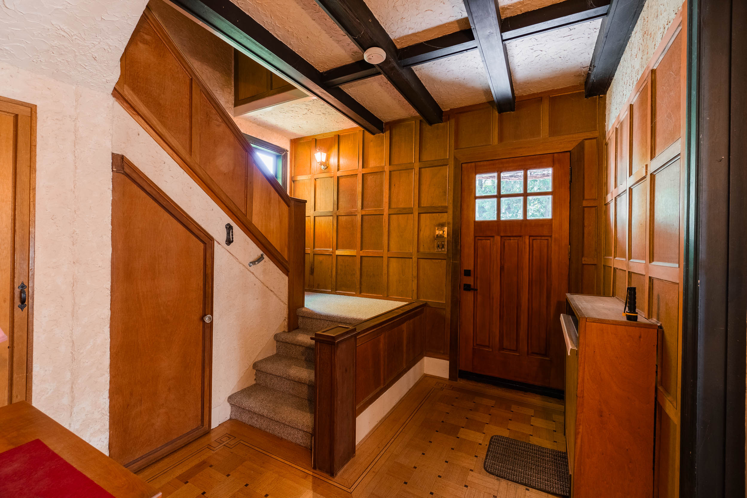 Wood-panelled heritage entry at 1107 Robertson Avenue