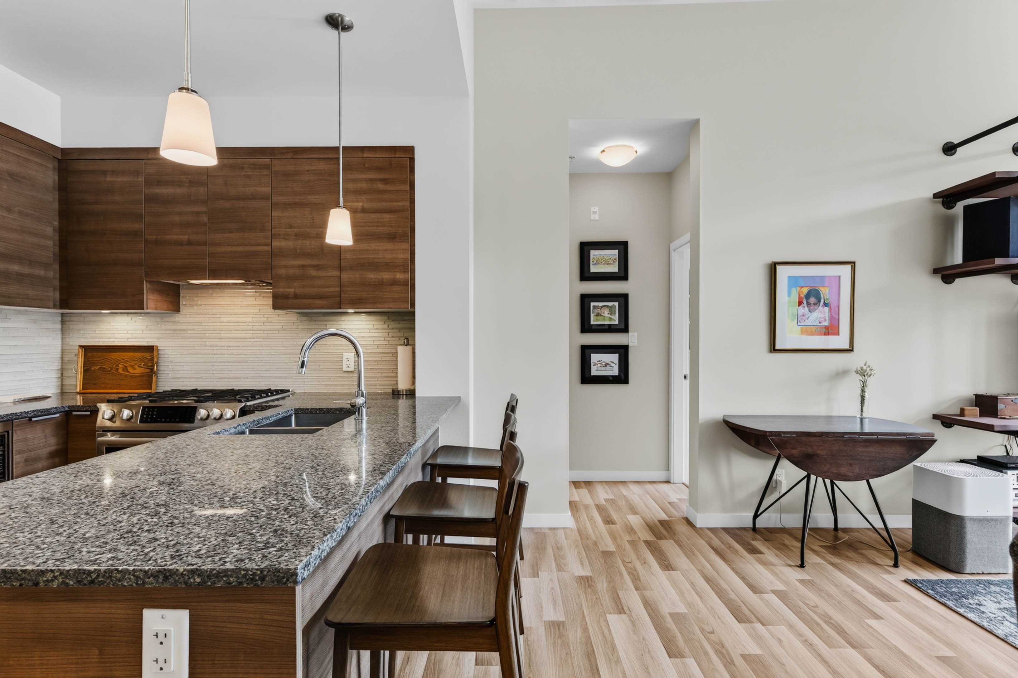 Modern kitchen and open living area in Unit 408 at Nelson Commons