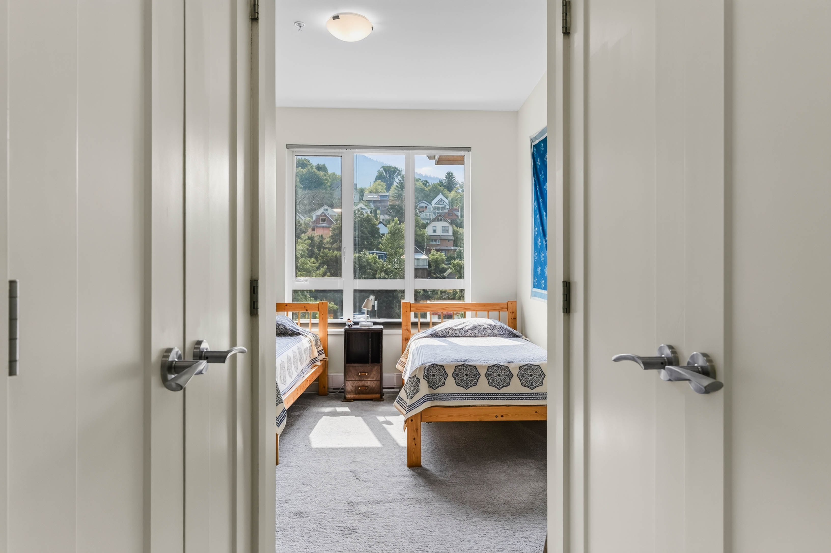 Bedroom with large windows and Nelson views at Unit 408