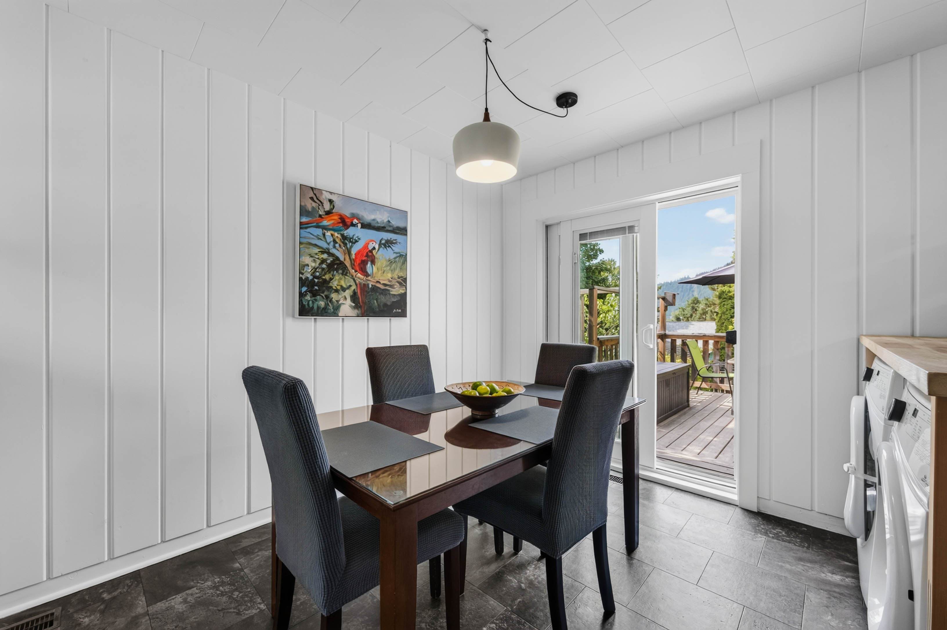 Dining area with sliding door opening onto the deck