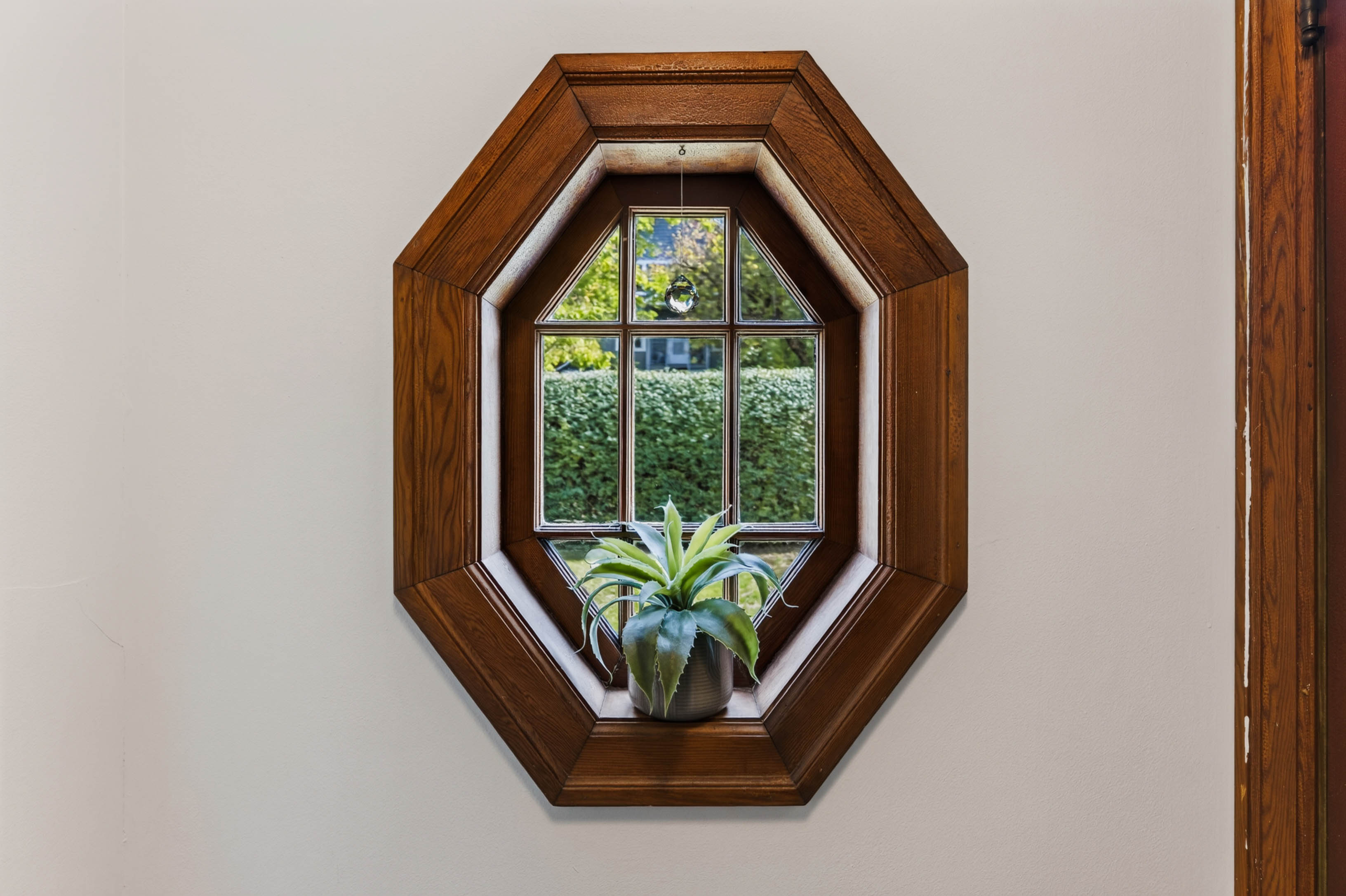 Octagonal window with warm wood trim