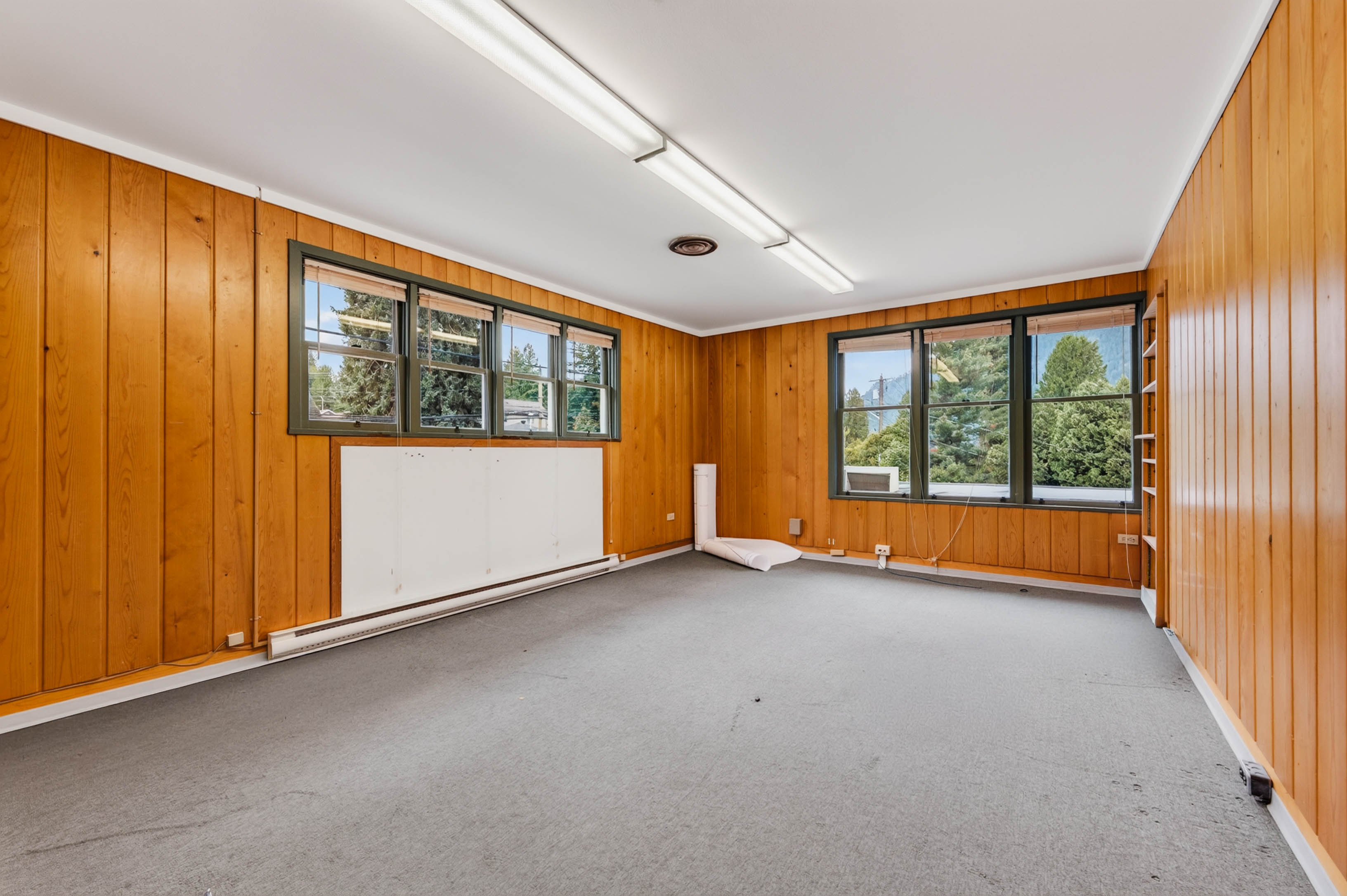 Enclosed room with windows on two walls