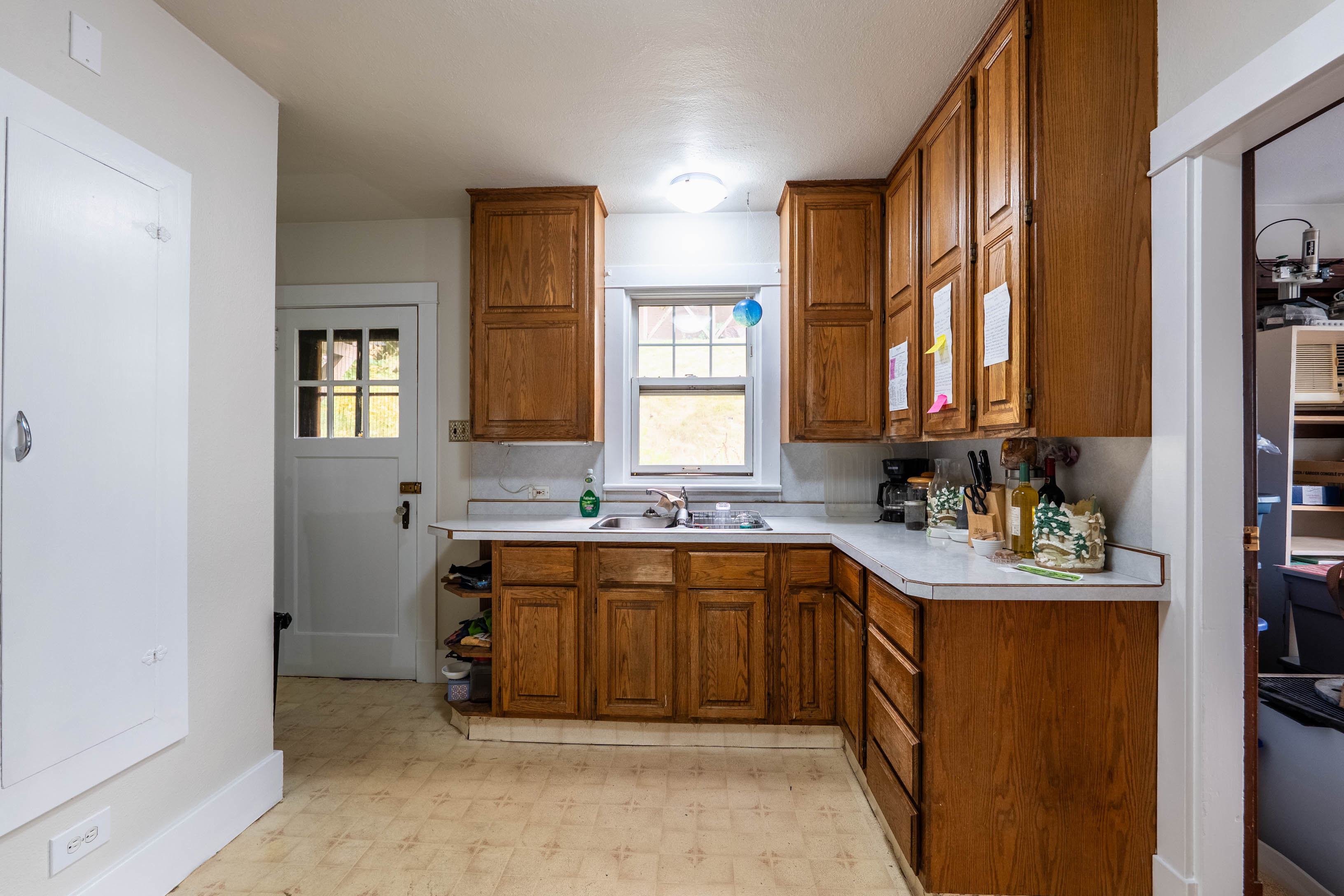 Kitchen with wood cabinetry and counter space
