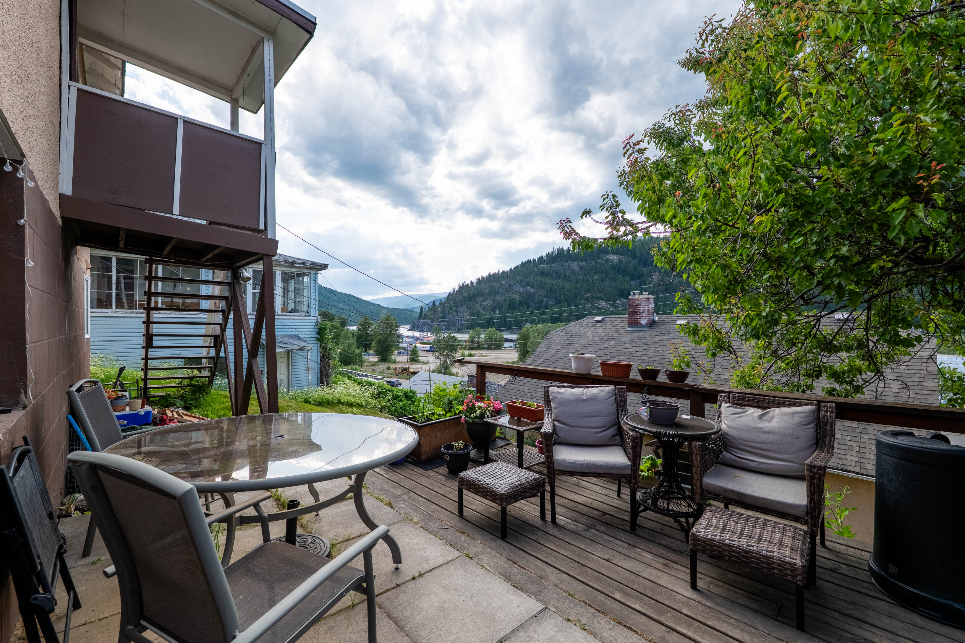 Outdoor deck with mountain and neighbourhood outlook