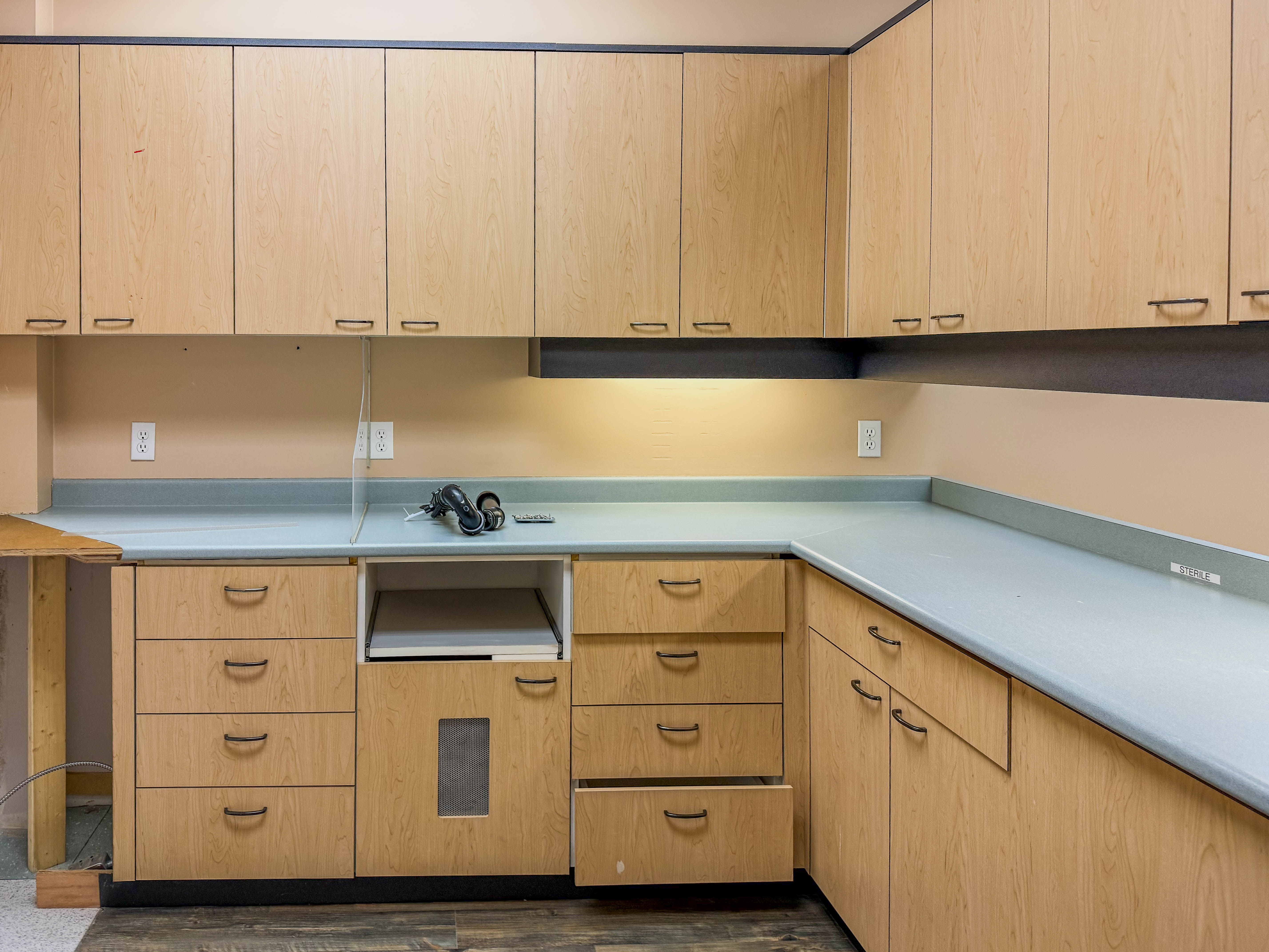 Built-in cabinetry, counter and sink area inside 310 Hall Street