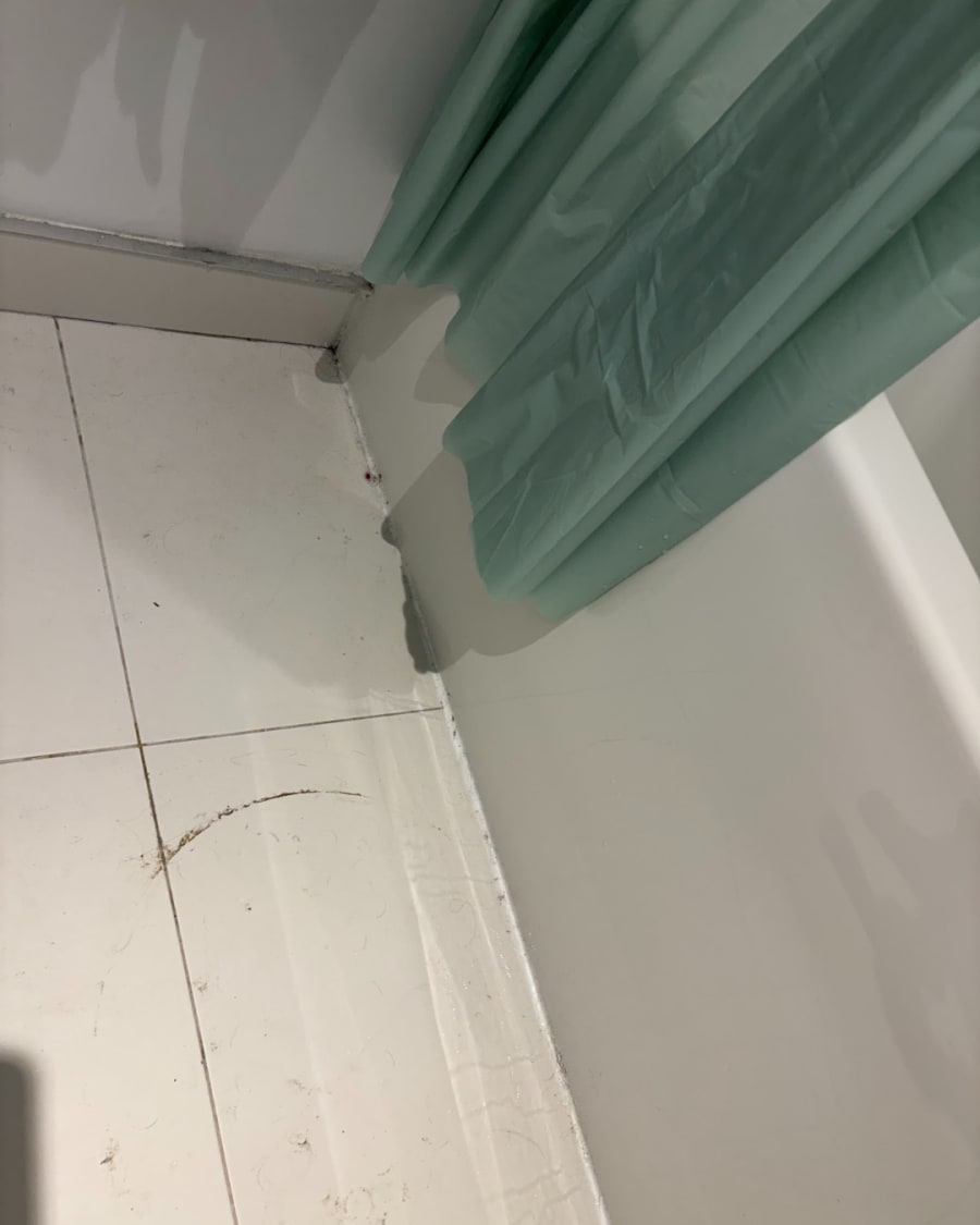 A scuffed, dusty floor before cleaning