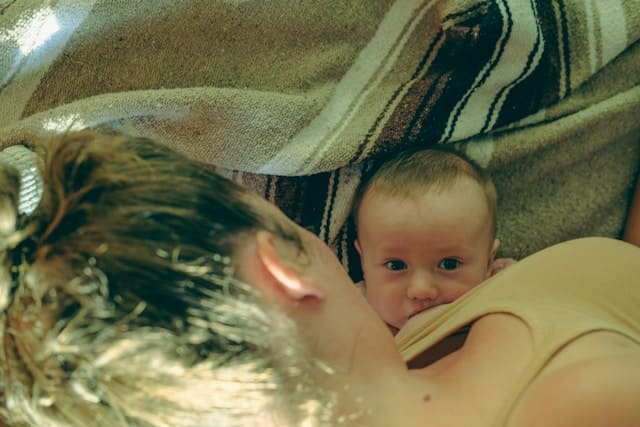 breastfeeding mother in a couch