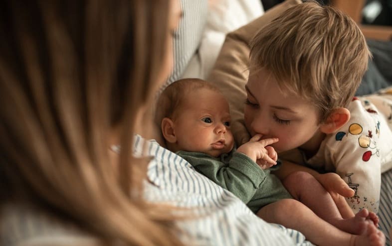 siblings with new baby