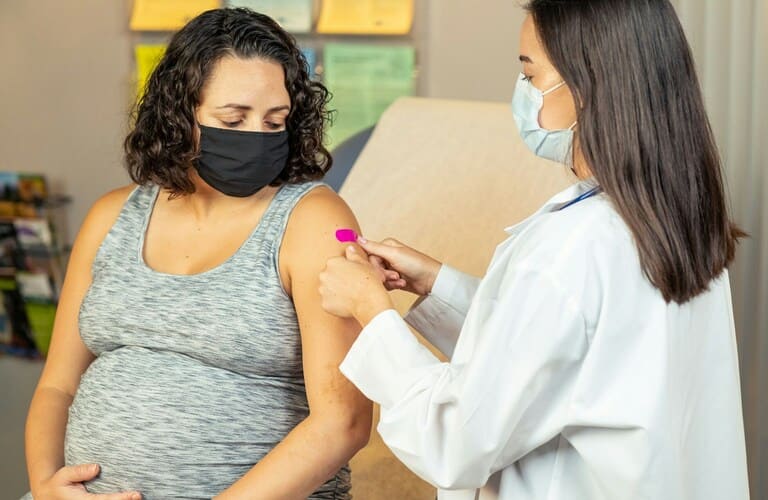 pregnant woman getting her sugar checked