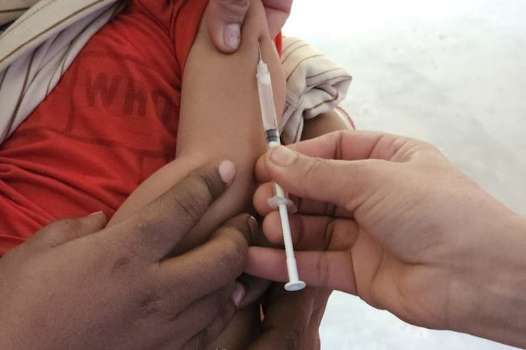 child receiving a bandage after vaccination