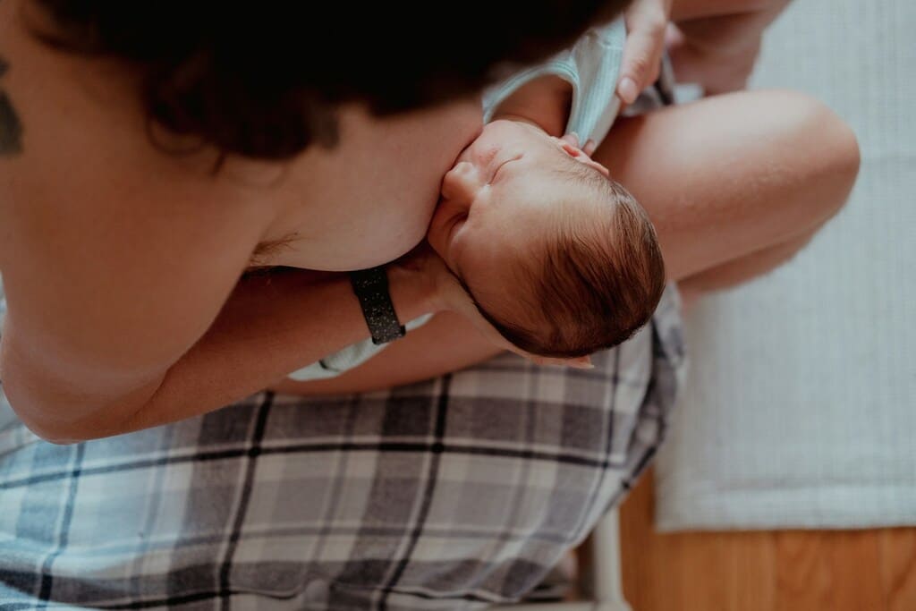 breastfeeding mother with baby