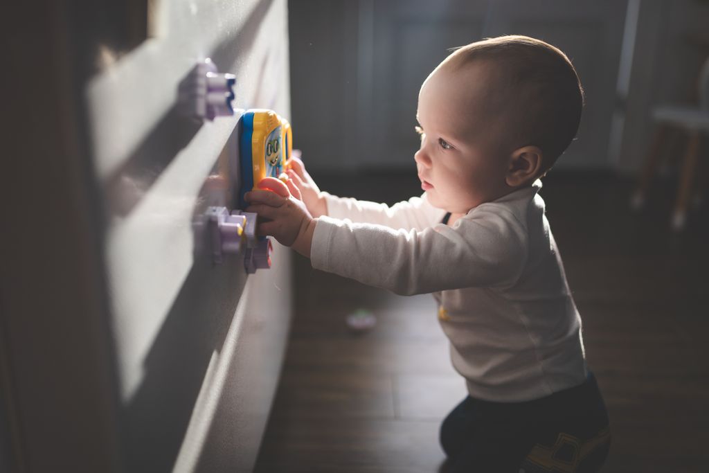 baby crawling on floor at home