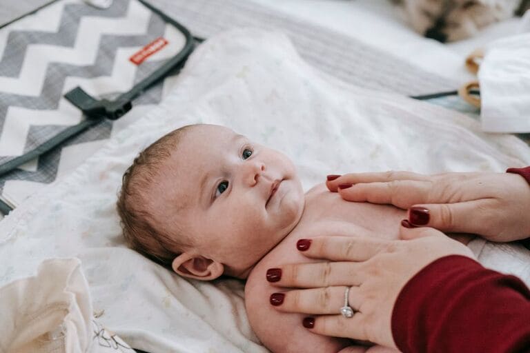 baby enjoying oil massage