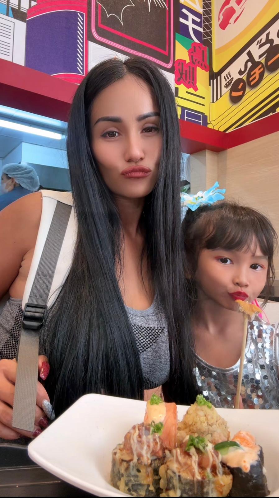 Yupa enjoying sushi with her daughter
