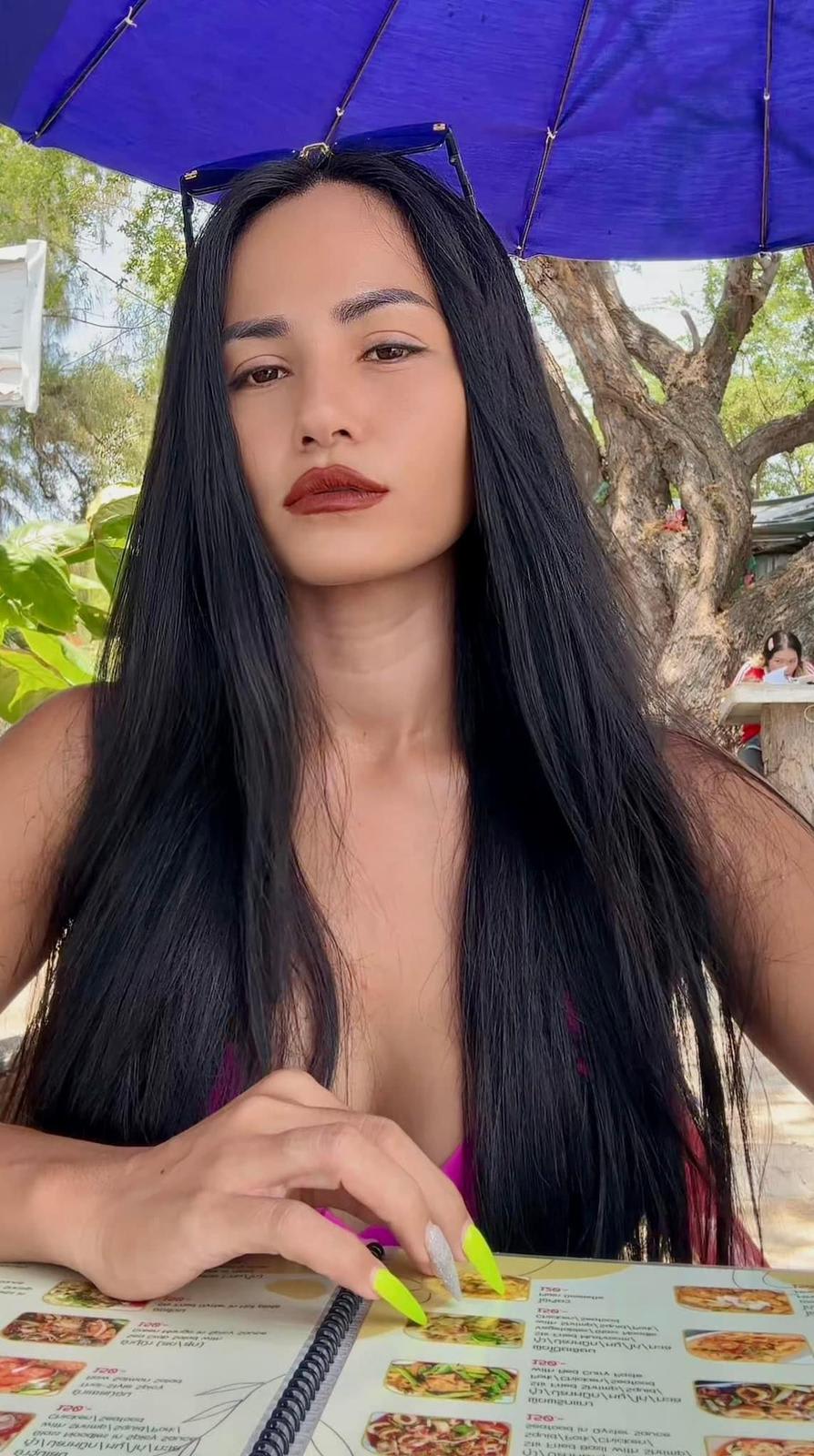 Yupa showcasing her menu selections, recommended Thai dishes