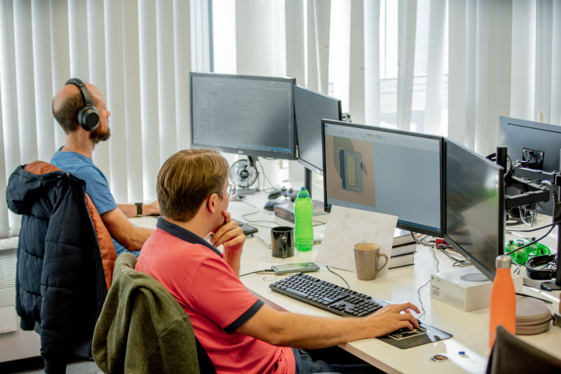 Kythera AI team members working in the main office.