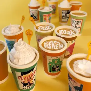 3-D illustration of a bunch of coffee cups decorated with book covers and some of the coffee has foam that reads “Fall Book Preview.”. Illustration by Jeff Hinchee, Conceptual, Food & Beverage, Whimsical, 