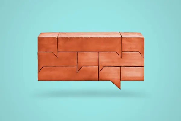 Graphic illustration of a bunch of brinks shaped like a talk bubble.