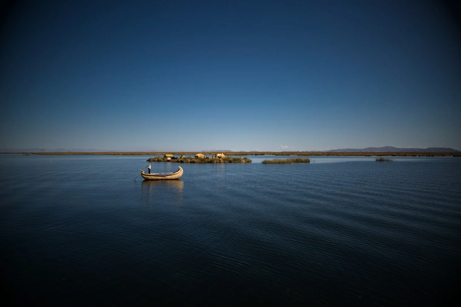 Lake Titicaca at sunrise with reed boats, Puno