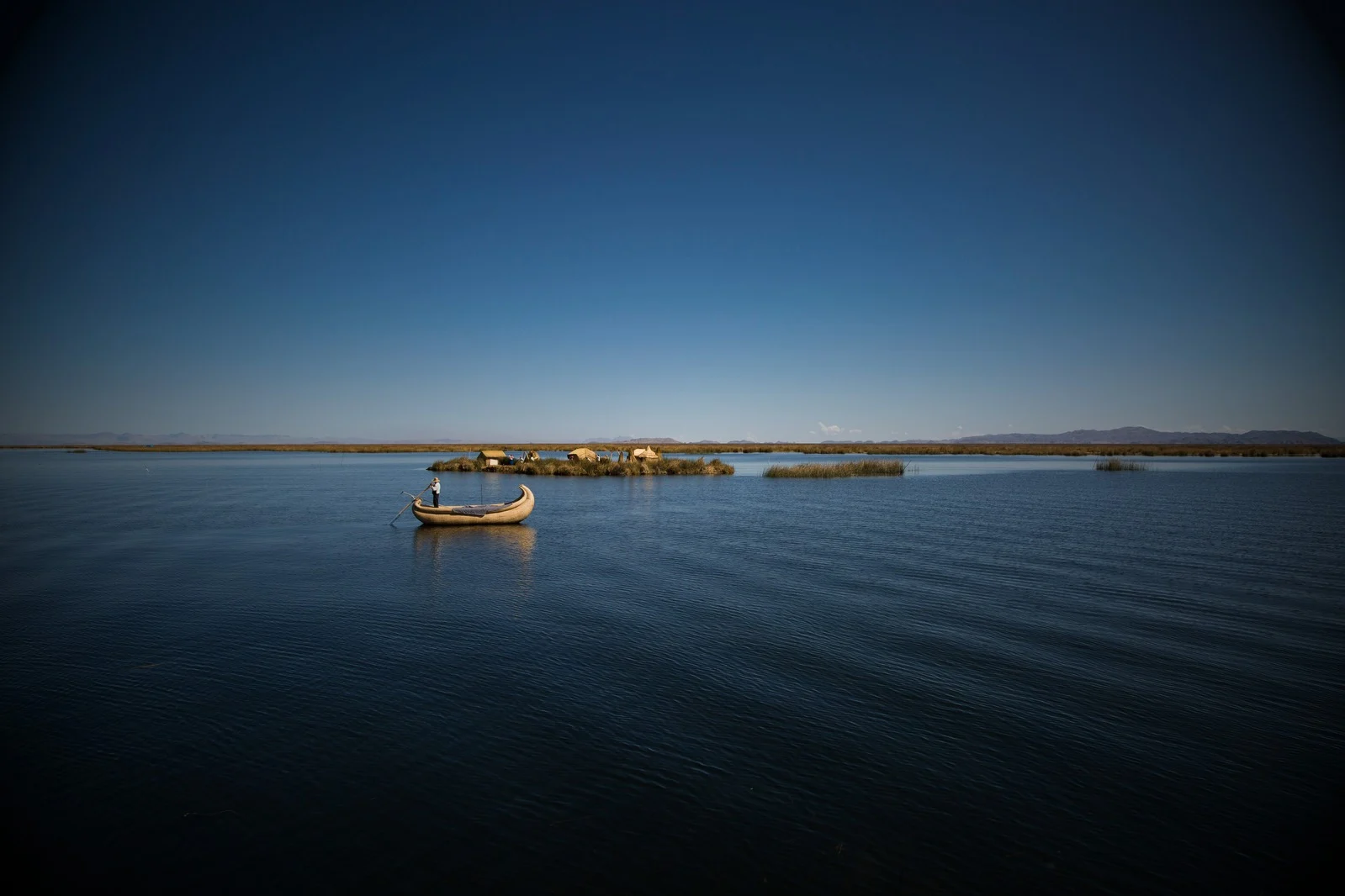 Lake Titicaca at sunrise with reed boats, Puno