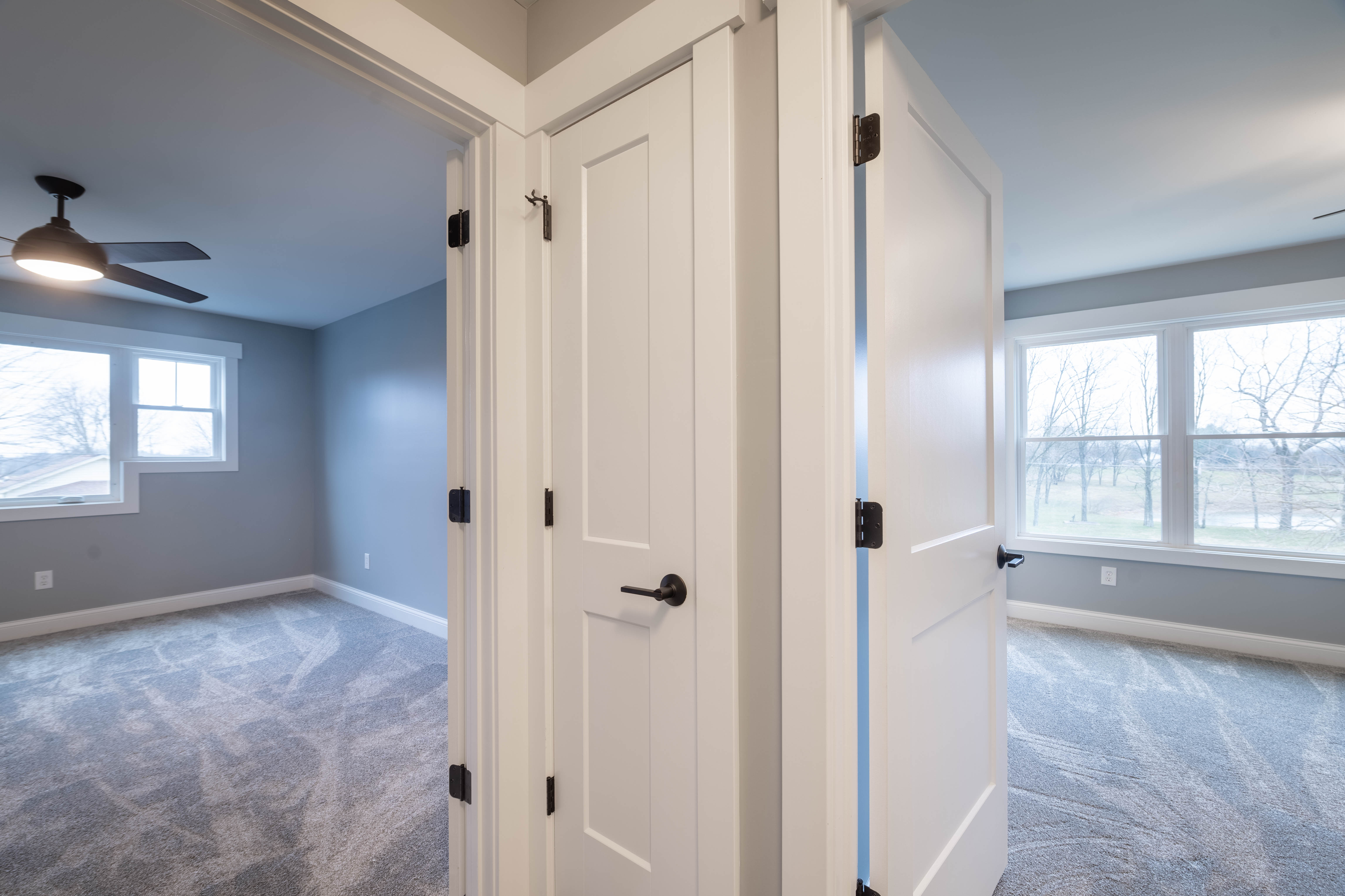 Master bedroom with tray ceiling in Alice custom home