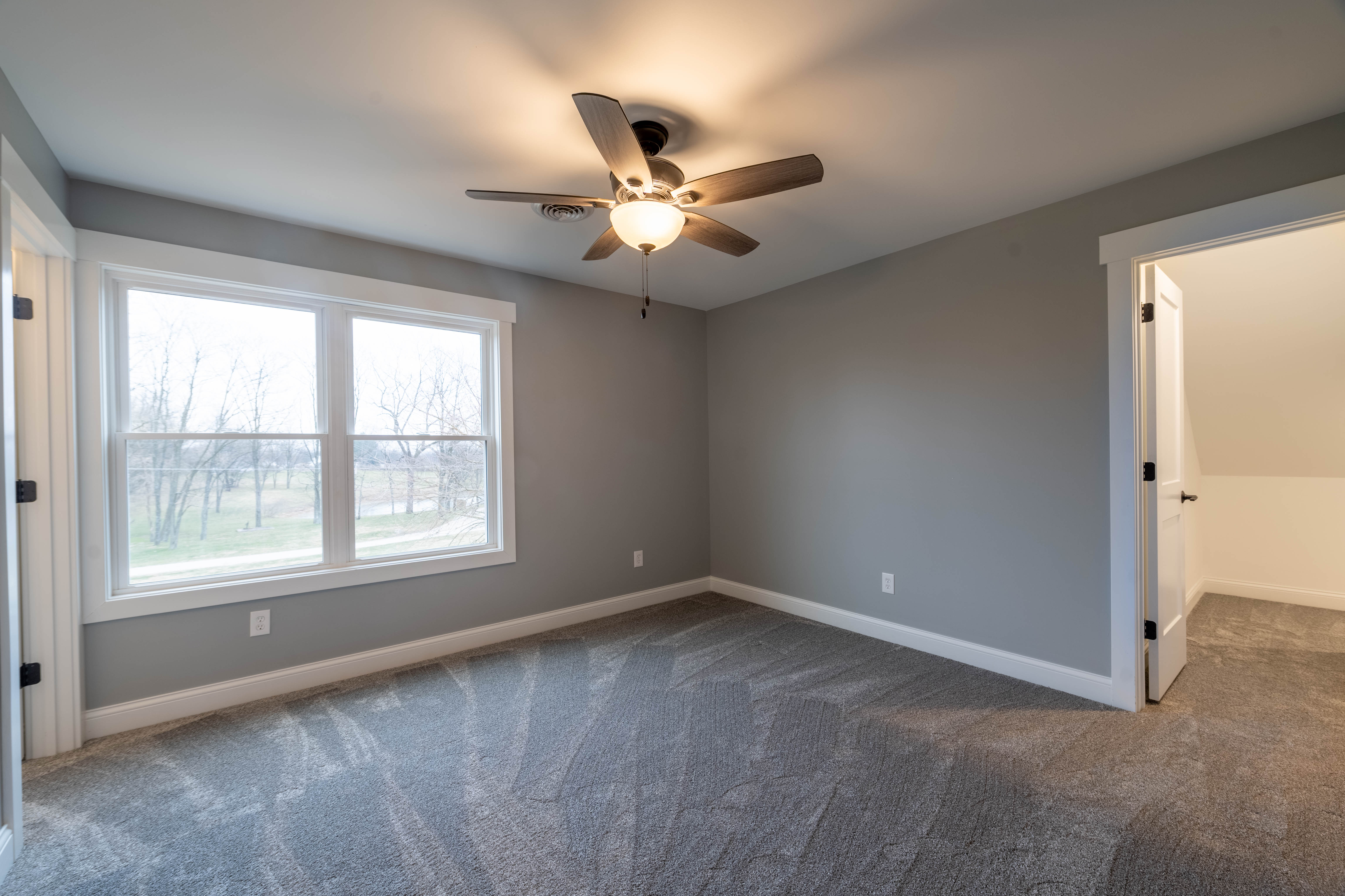 Master bedroom windows and natural light in Lawrenceburg home
