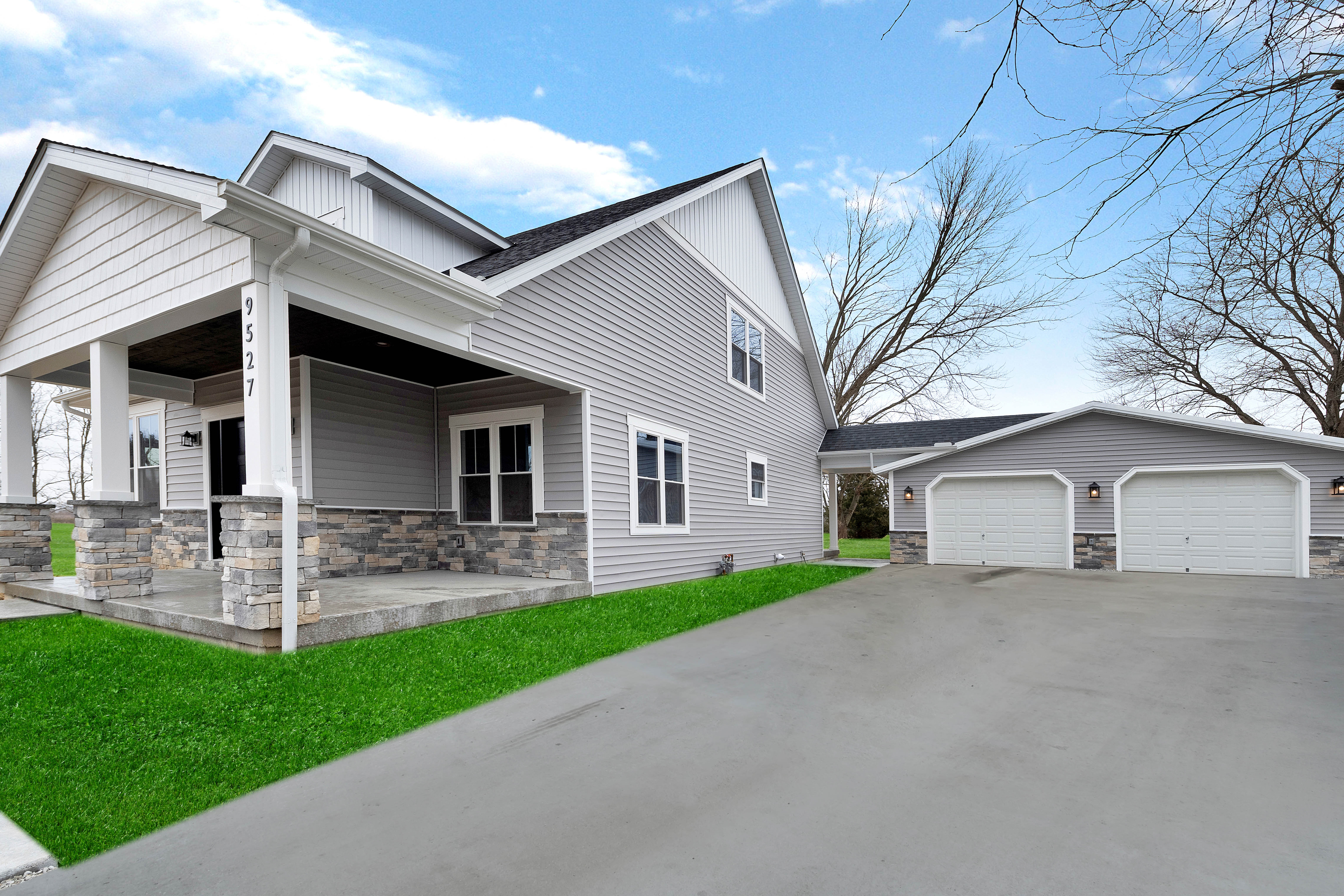 Finished exterior with mature landscaping at Alice home