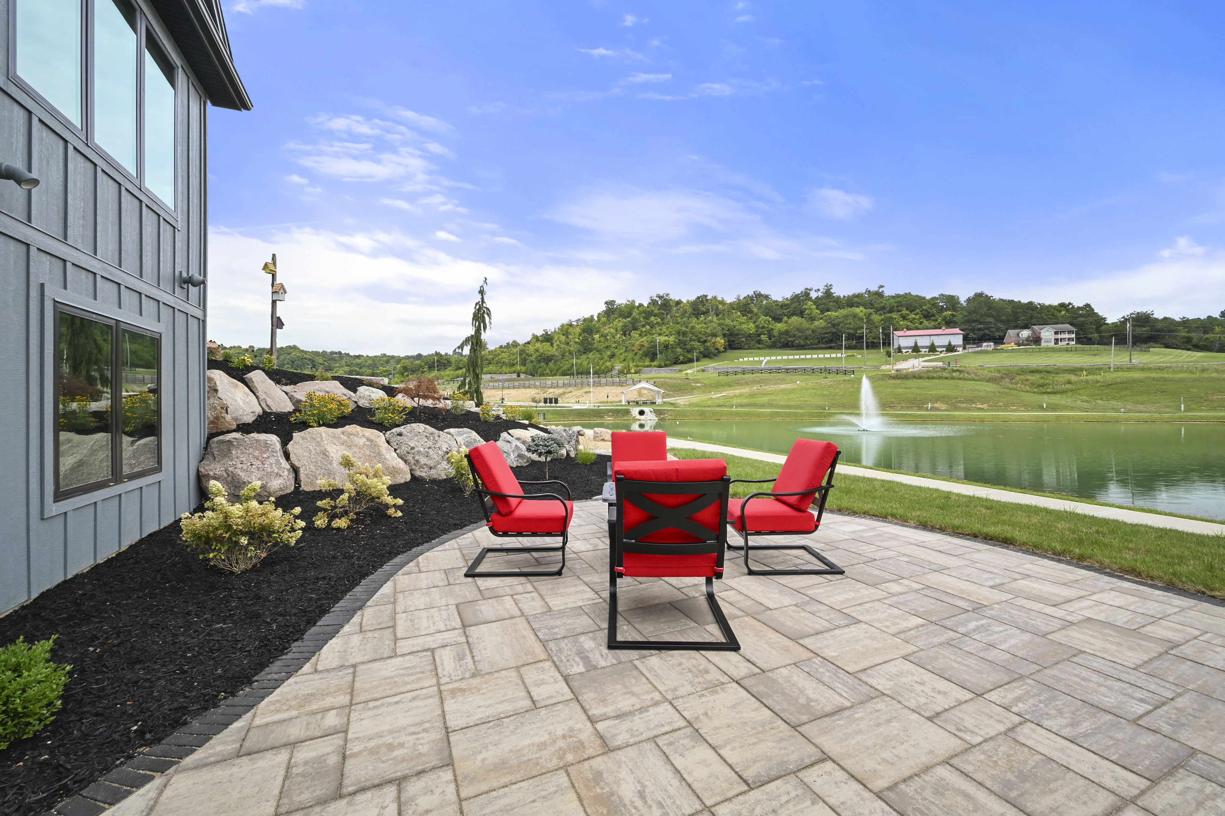 Completed custom home exterior with mature landscaping
