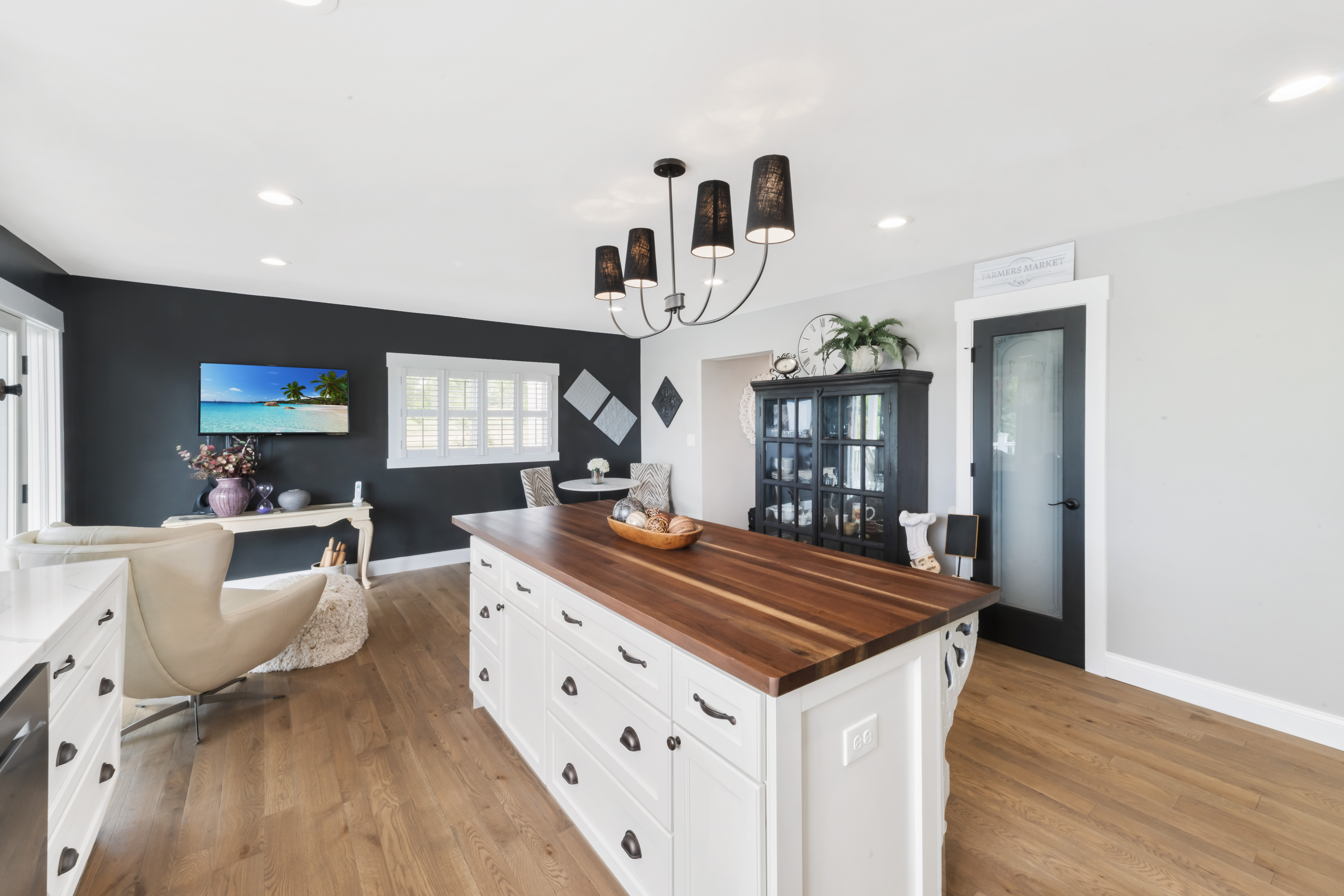 Family room with fireplace after Cleeter residence renovation
