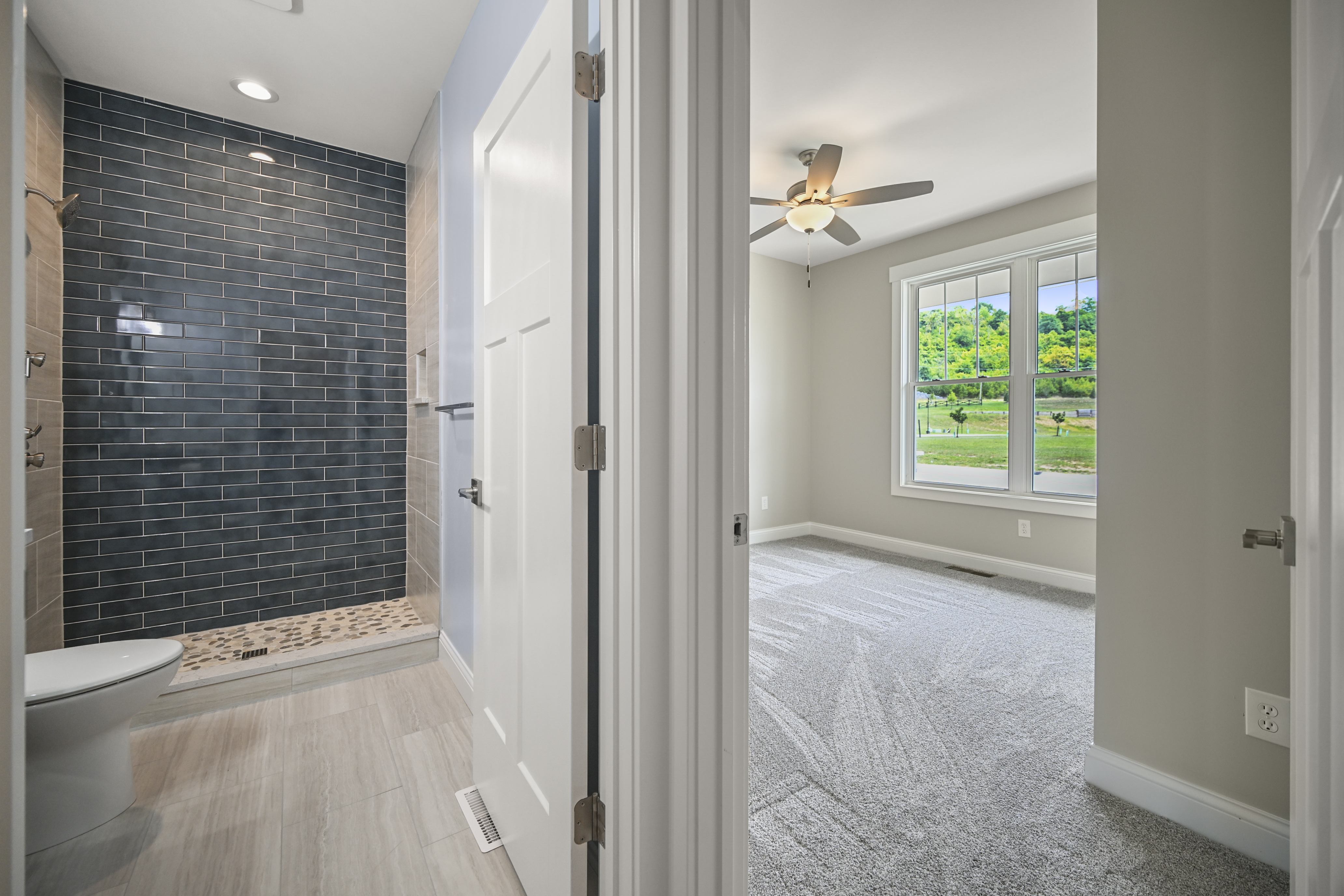 Master bedroom with crown molding and natural light