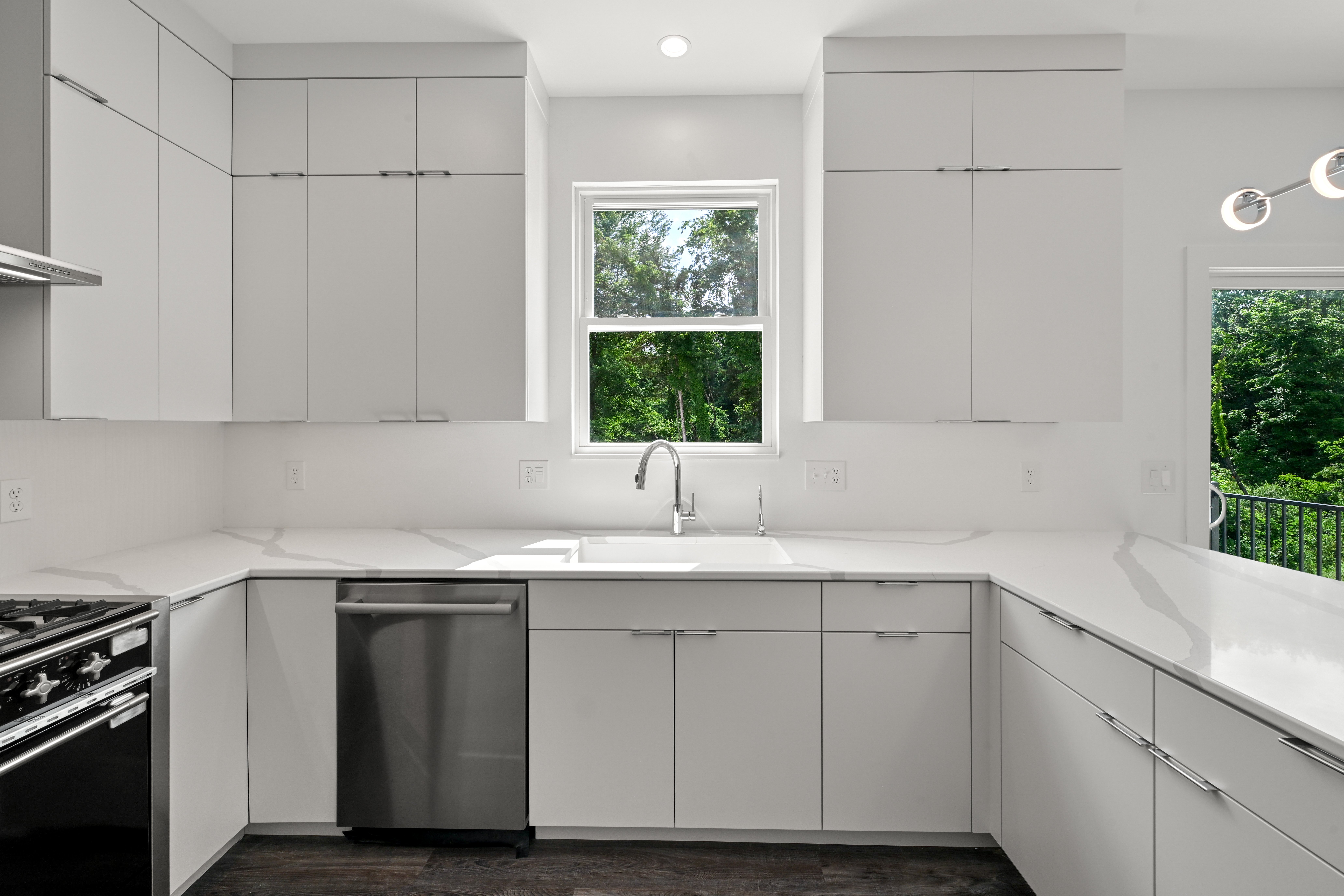 Floor-to-ceiling windows and natural light in Cameron great room