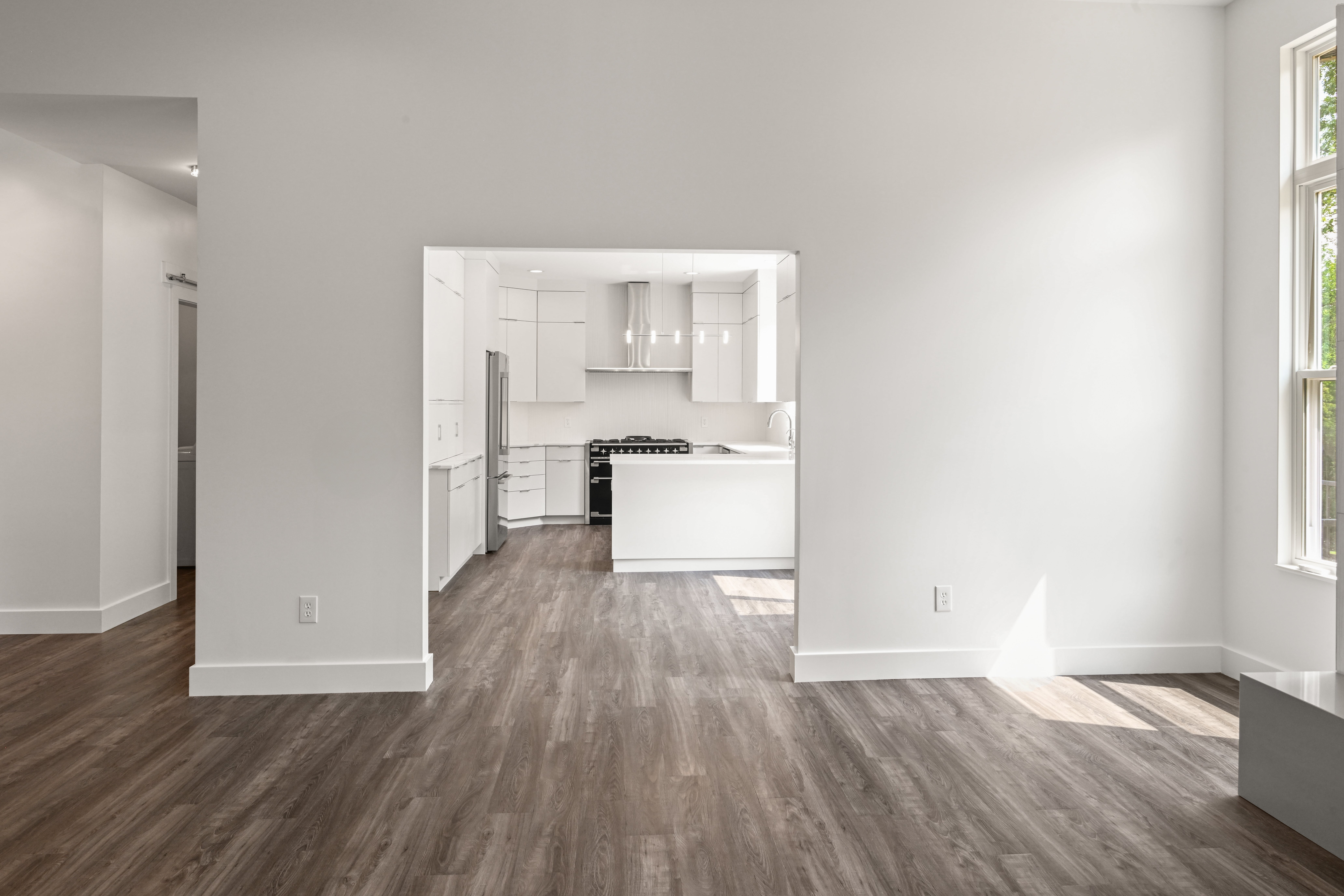 Dining room with chandelier and wainscoting in custom home