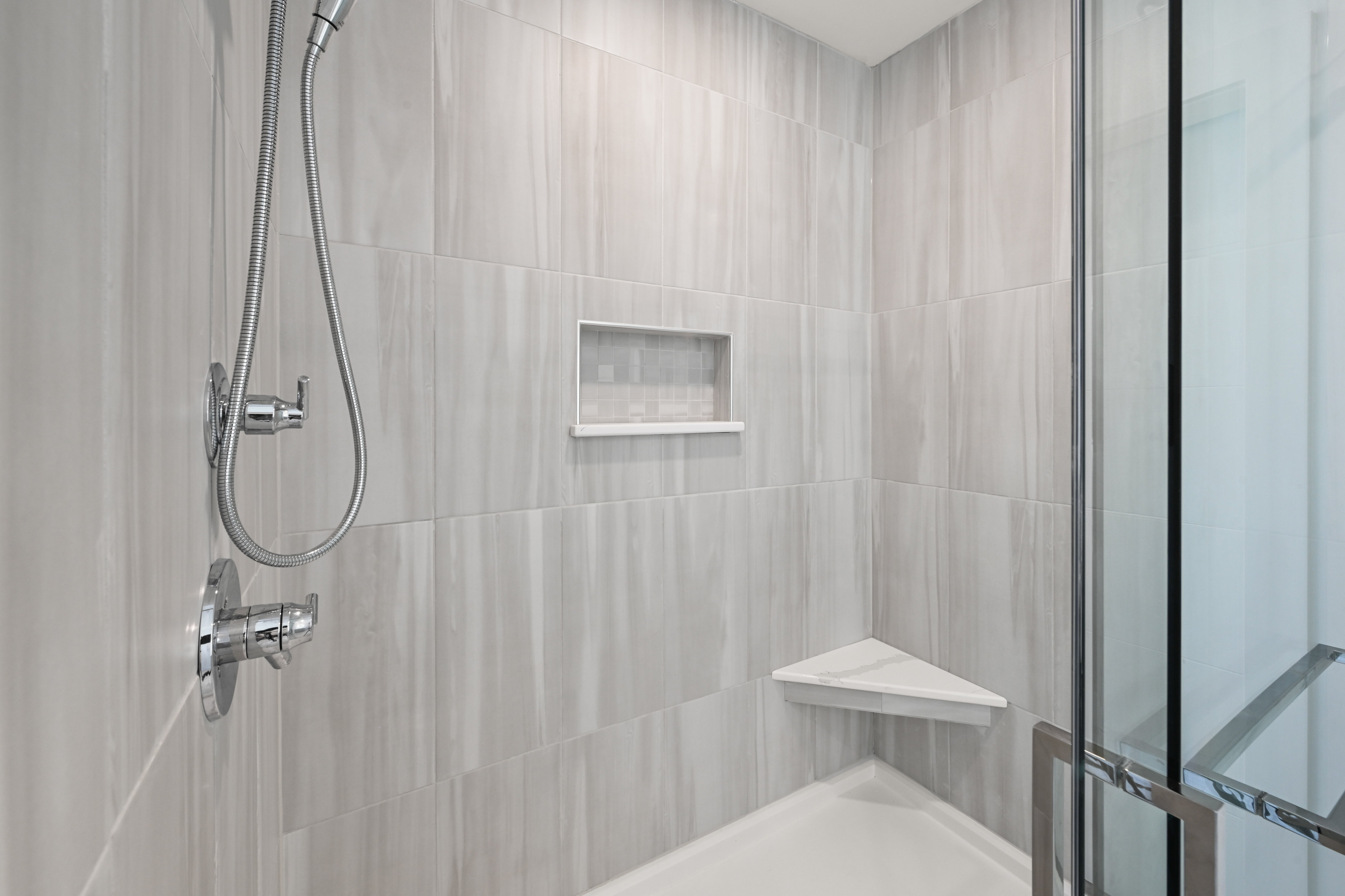Master bathroom with freestanding tub and marble tile