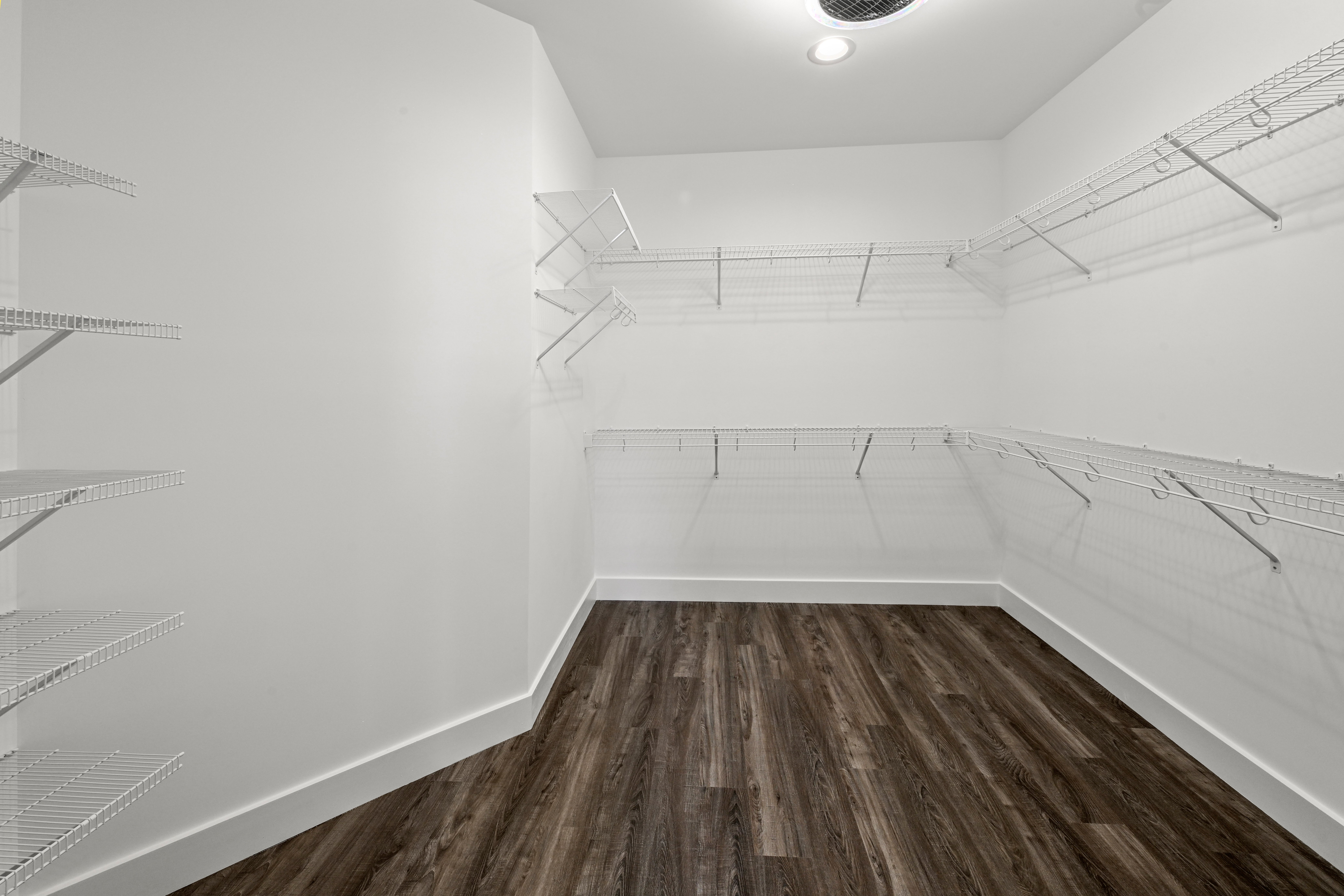 Walk-in shower with glass enclosure and custom tile in master bath