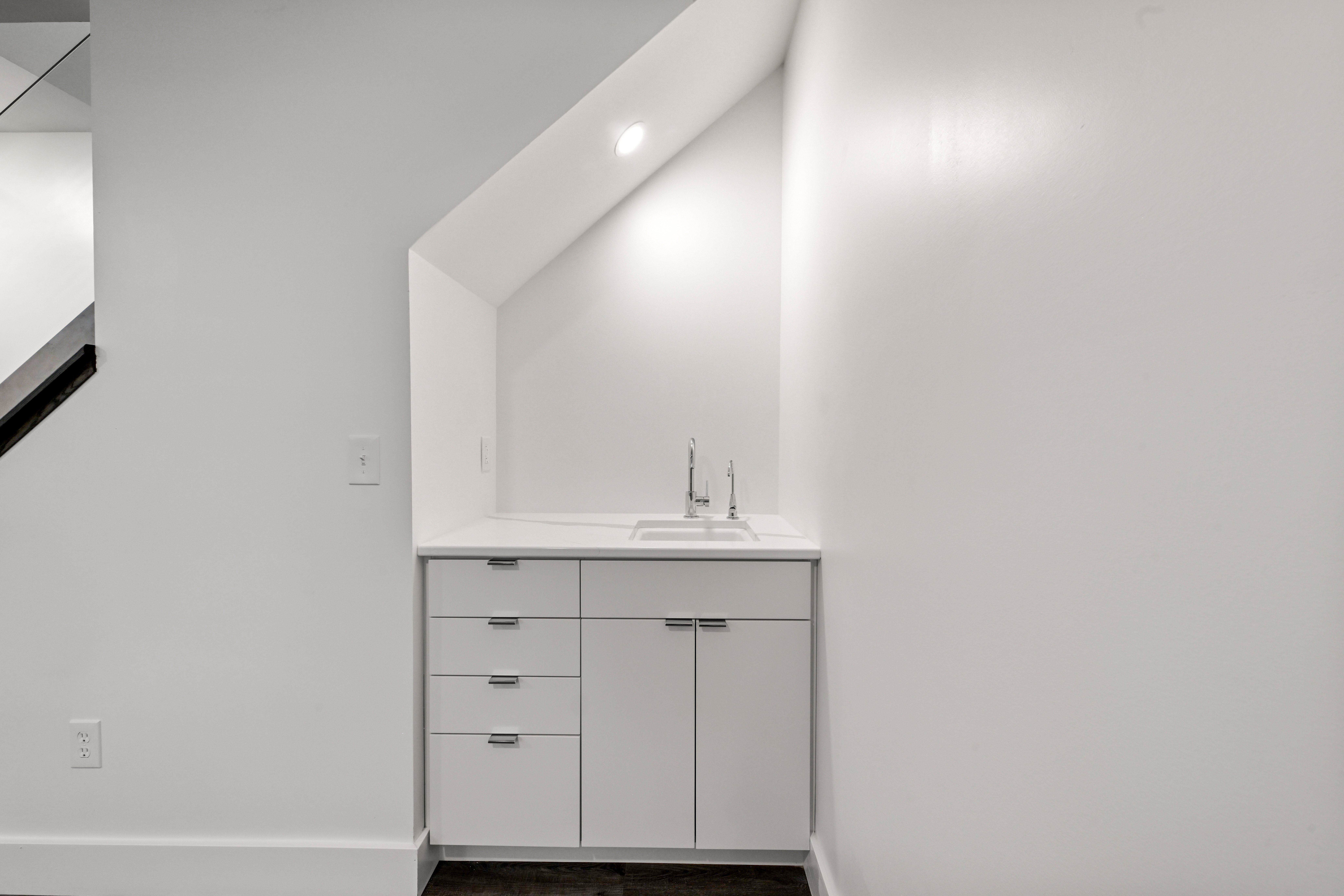 Mudroom with built-in lockers and bench in Cameron home