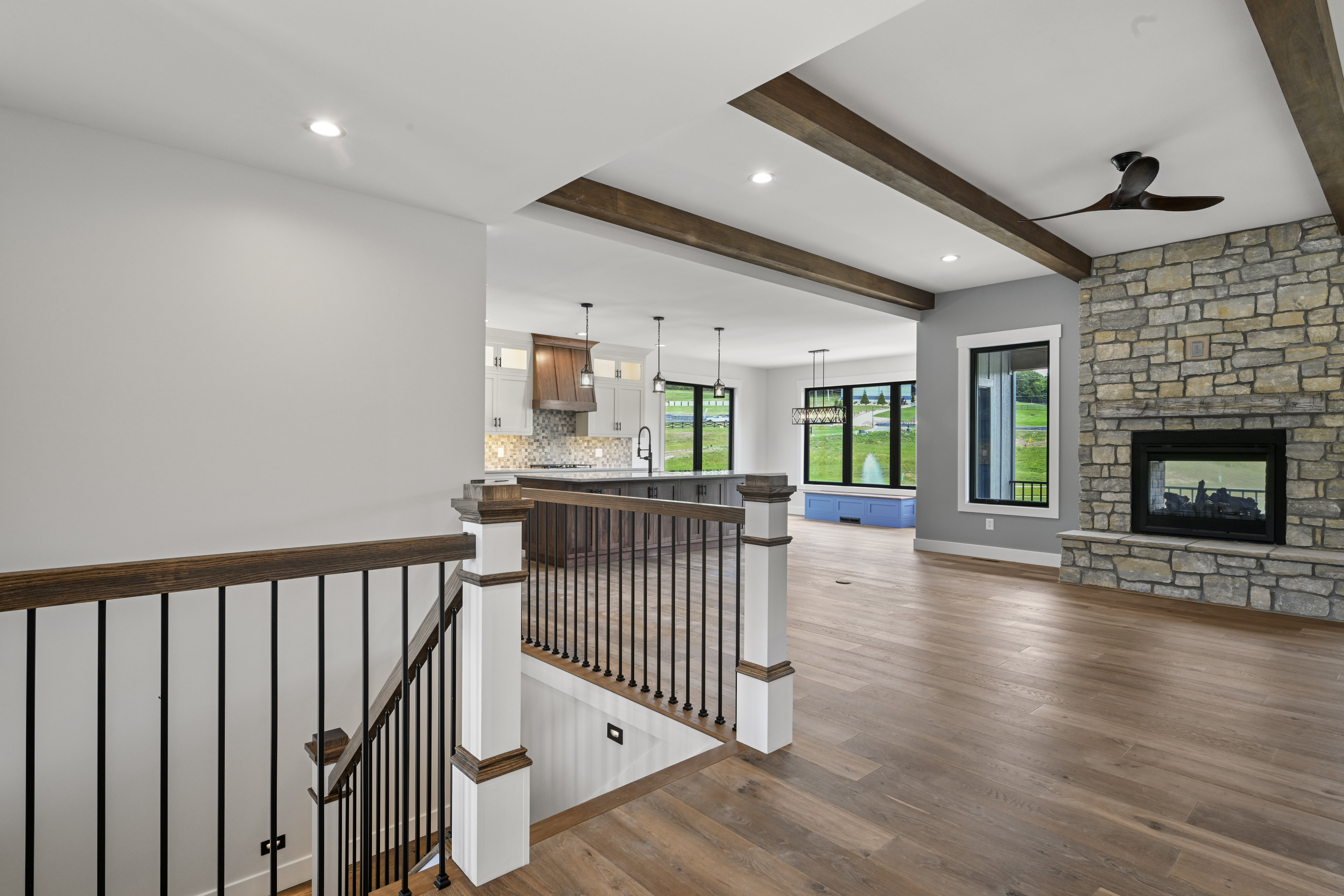 Great room fireplace and built-in cabinetry by JDC Construction