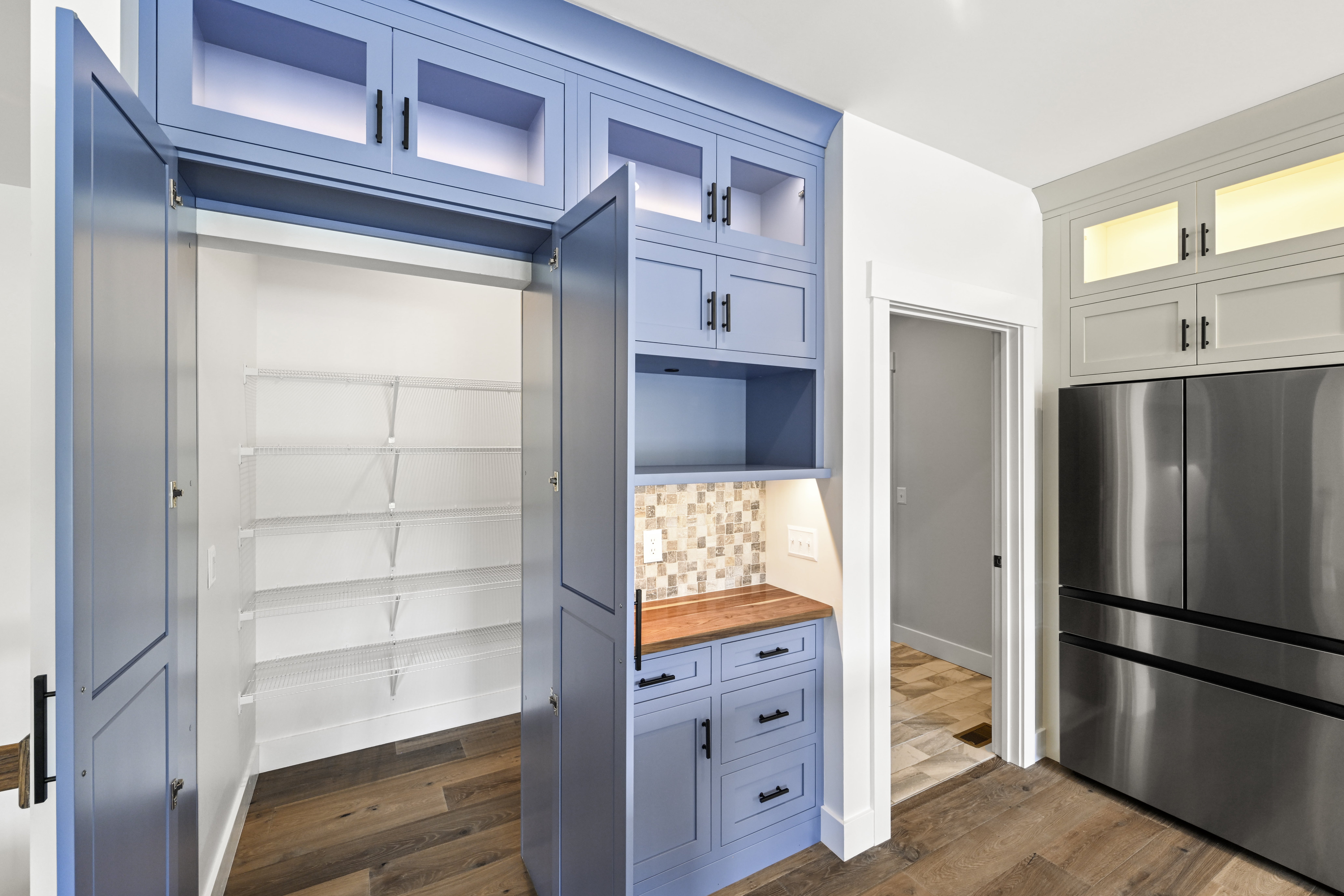Open living space with custom built-ins and trim work