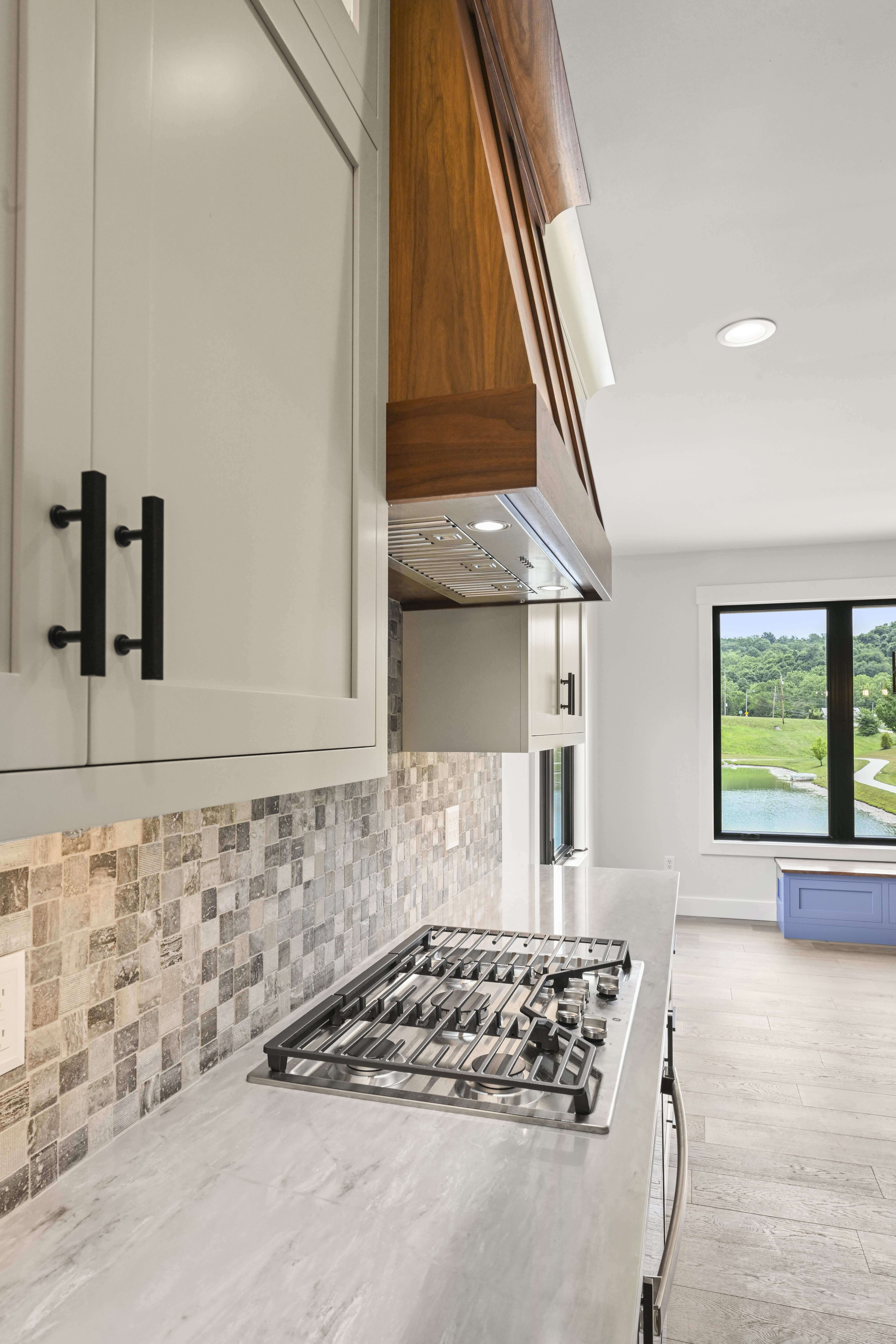 Custom kitchen with island and pendant lighting in Lawrenceburg home