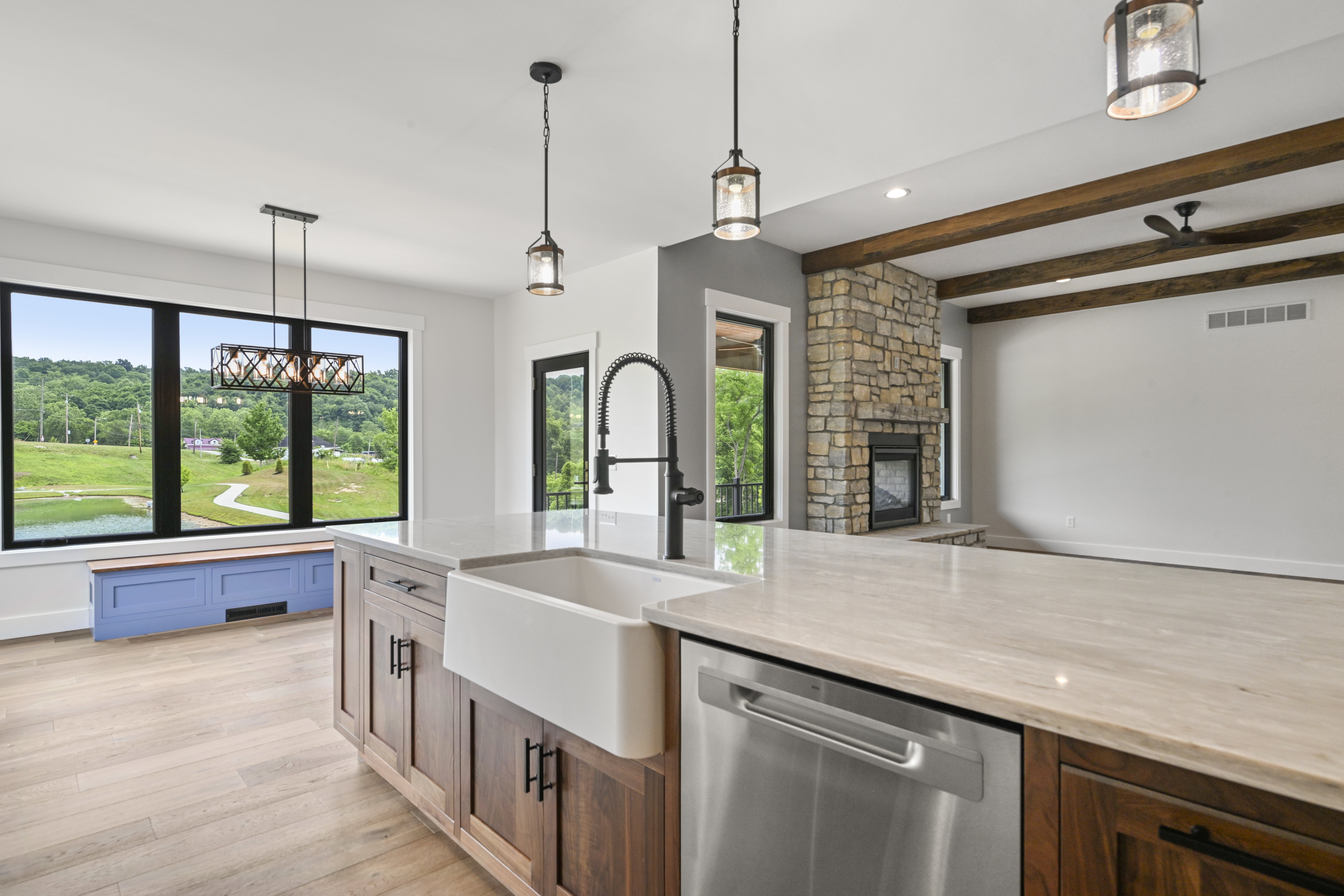 White cabinetry and quartz countertops in custom kitchen