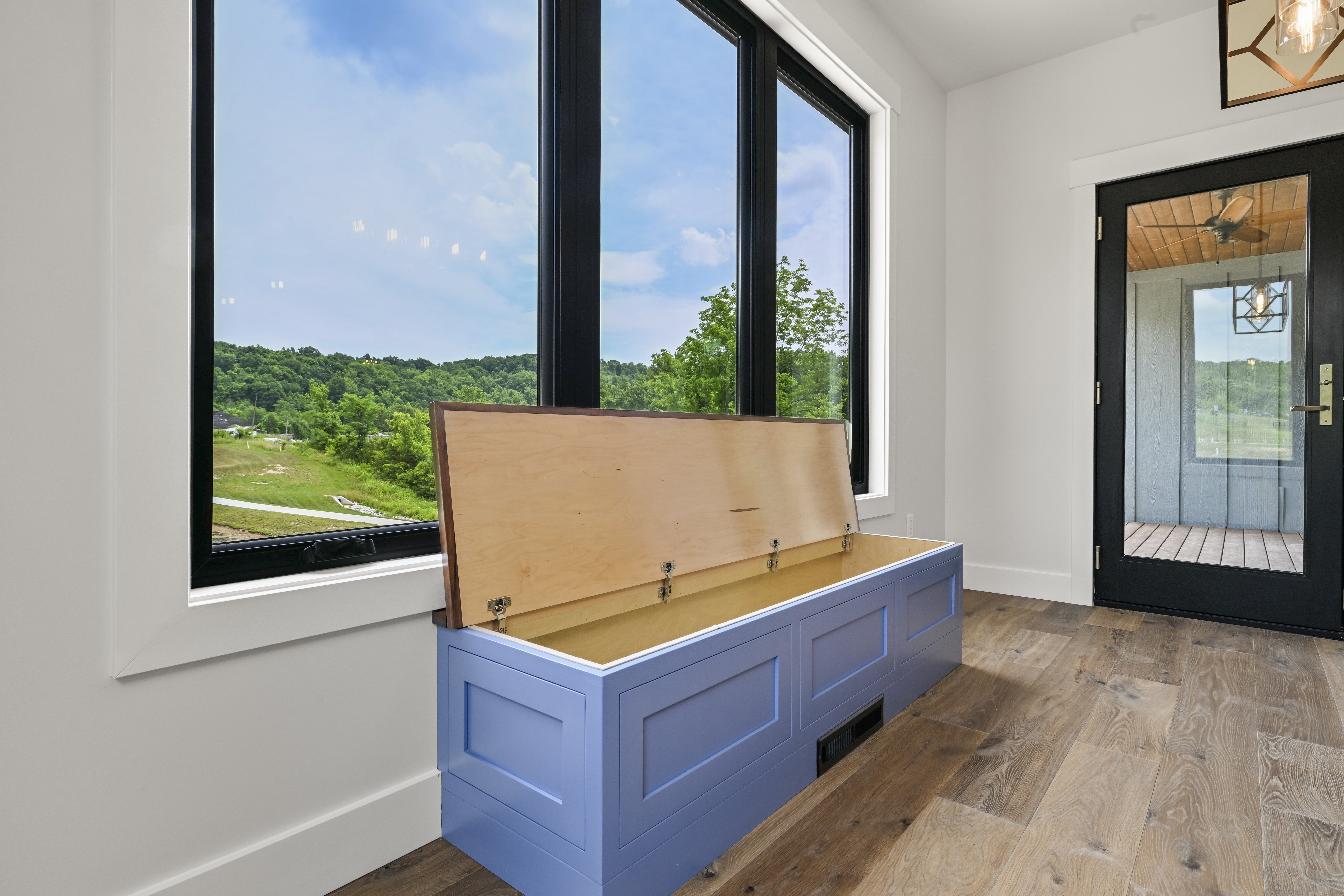 Walk-in pantry with custom shelving in Caudill residence